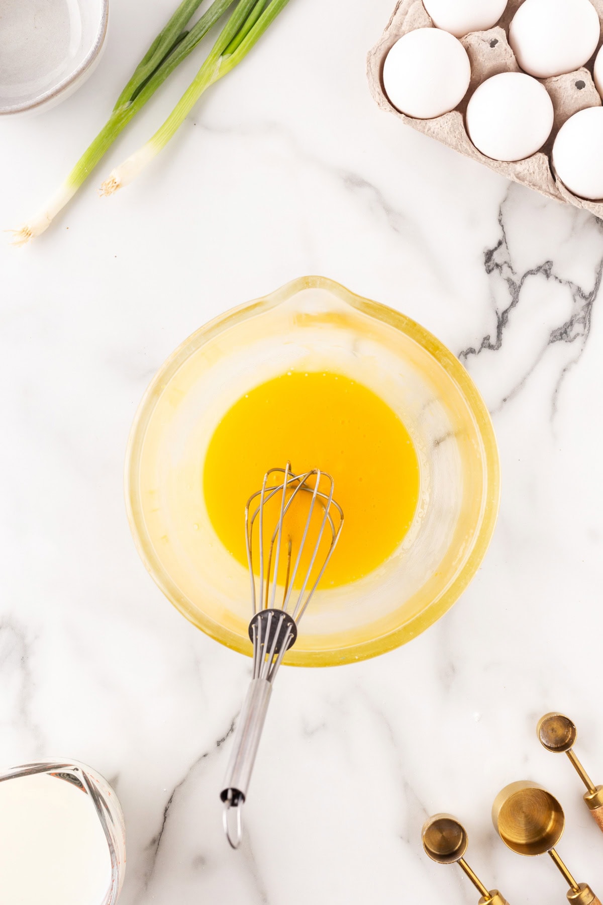 Egg yolks in a bowl after whisking. 