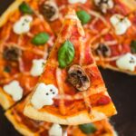 Close-up of a slice of Halloween pizza.