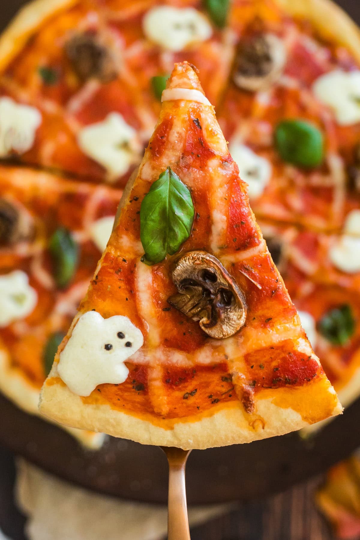 Overhead shot of slice of Halloween Pizza.