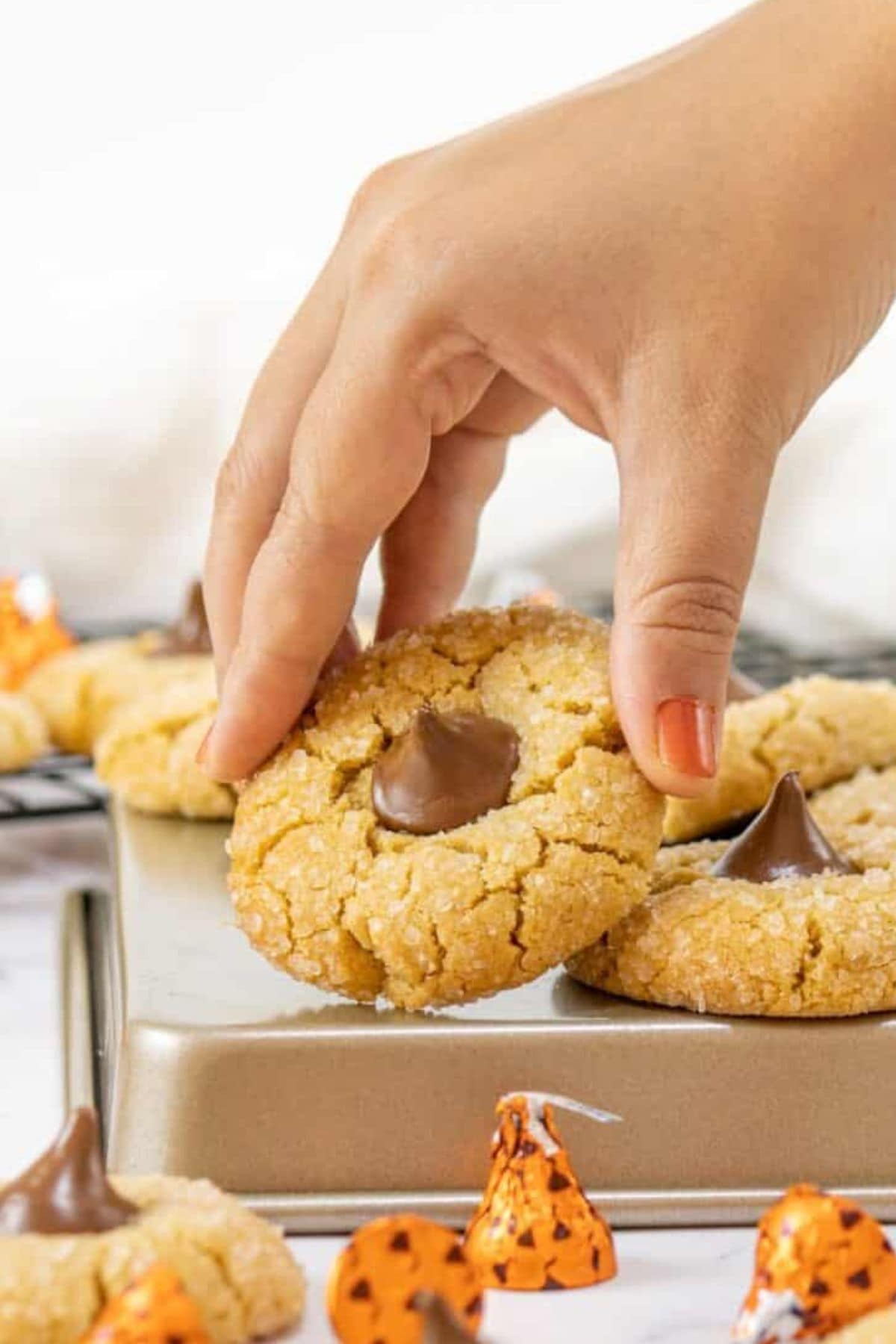 Blossom cookies on pan.