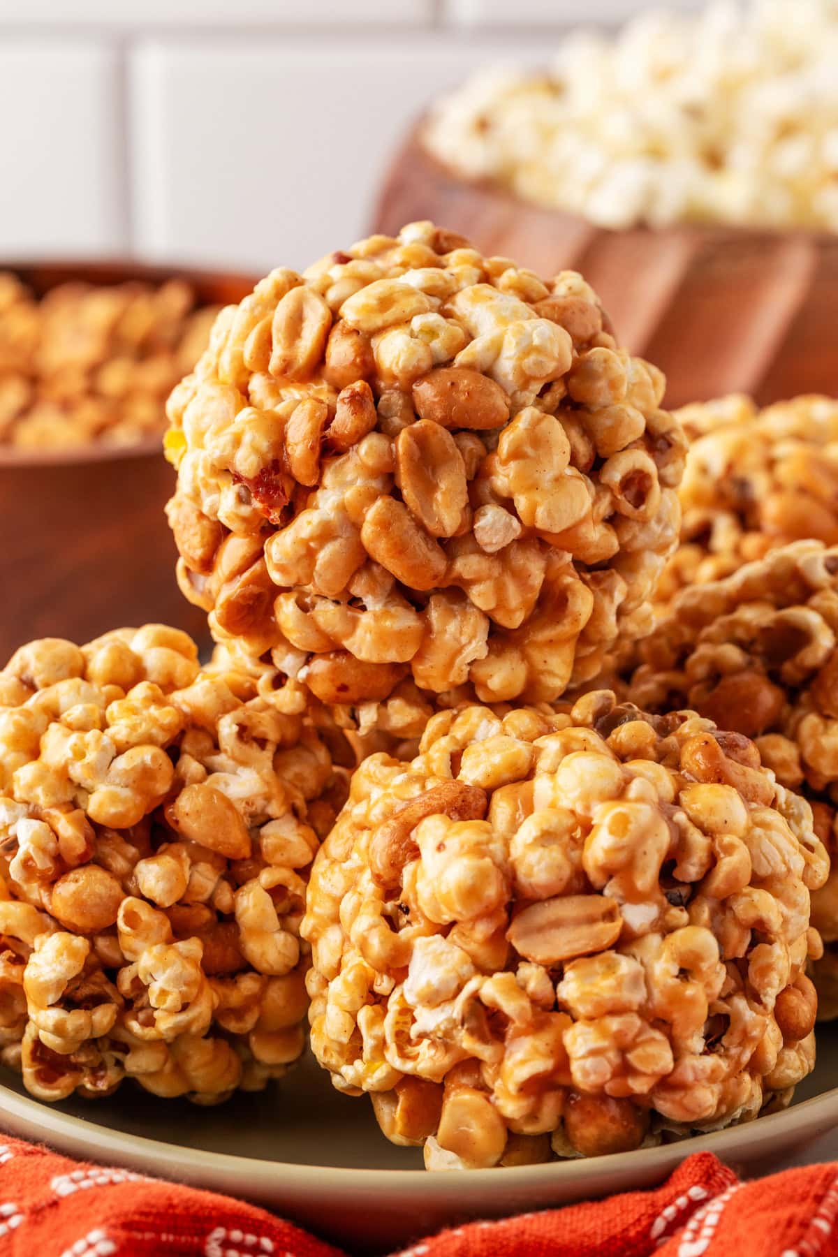 Popcorn Balls with Peanuts piled on top of each other. 