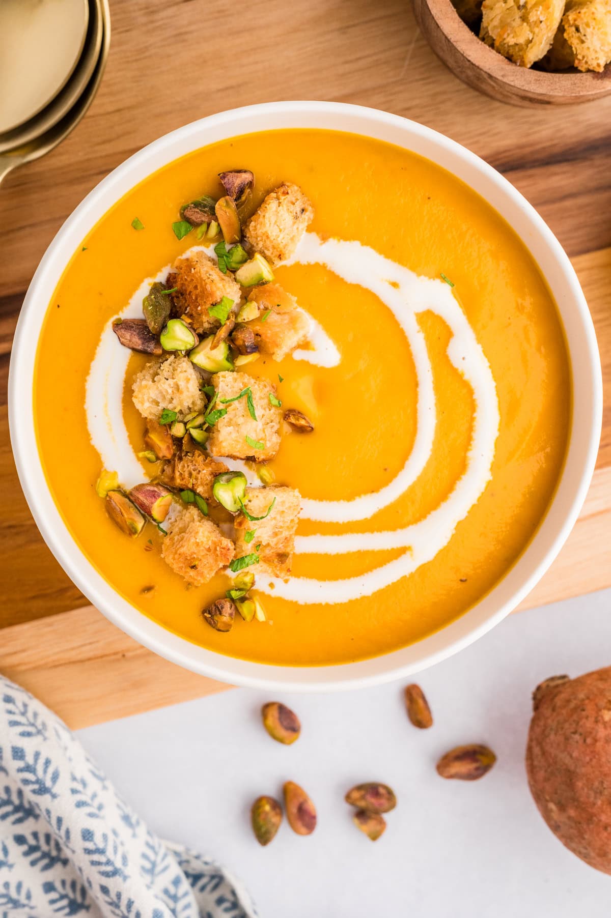 Overhead of Sweet Potato Soup with garnishes. 