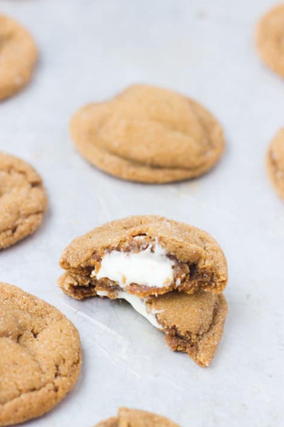 Cookie broken in half on table.