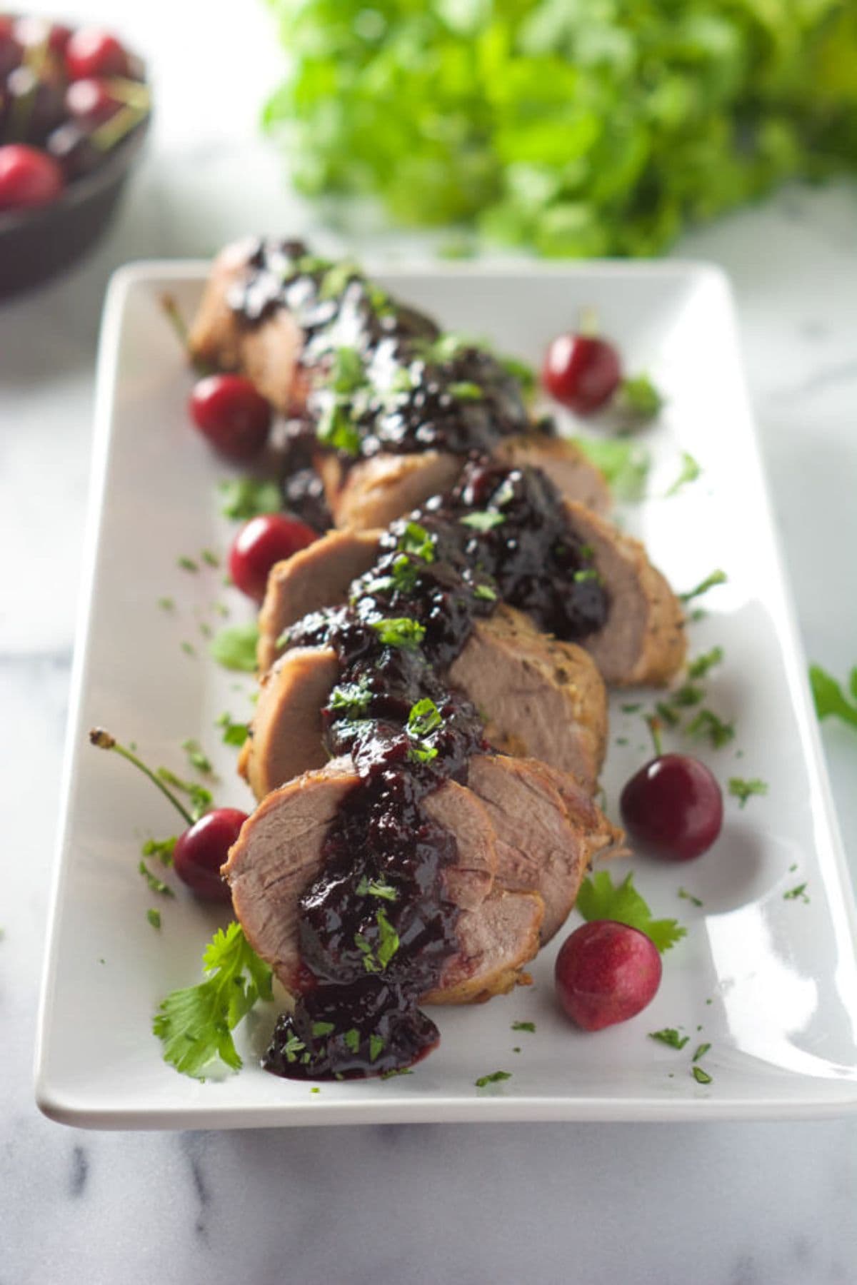 Pork tenderloin on platter.