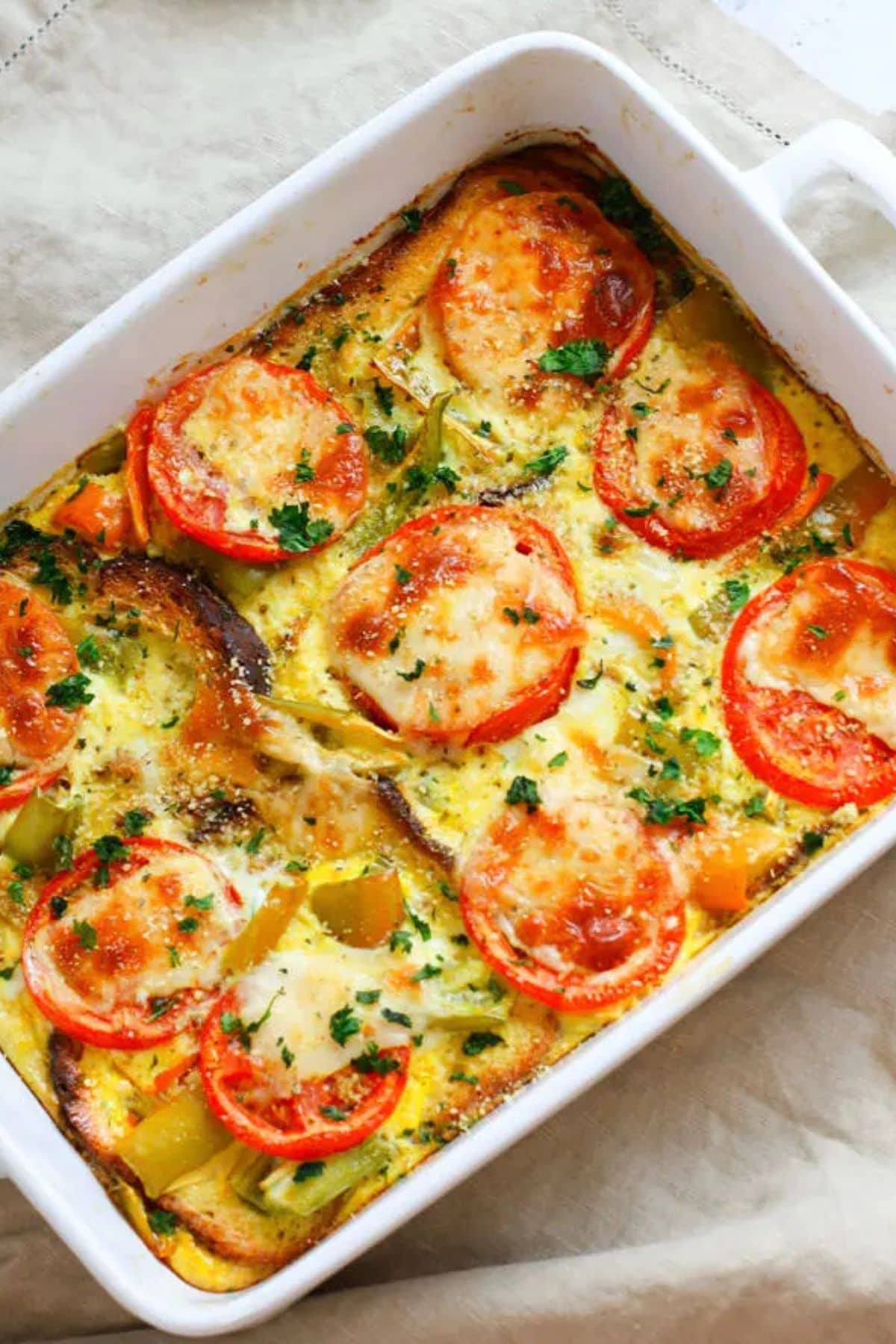 Tomato egg casserole in dish.