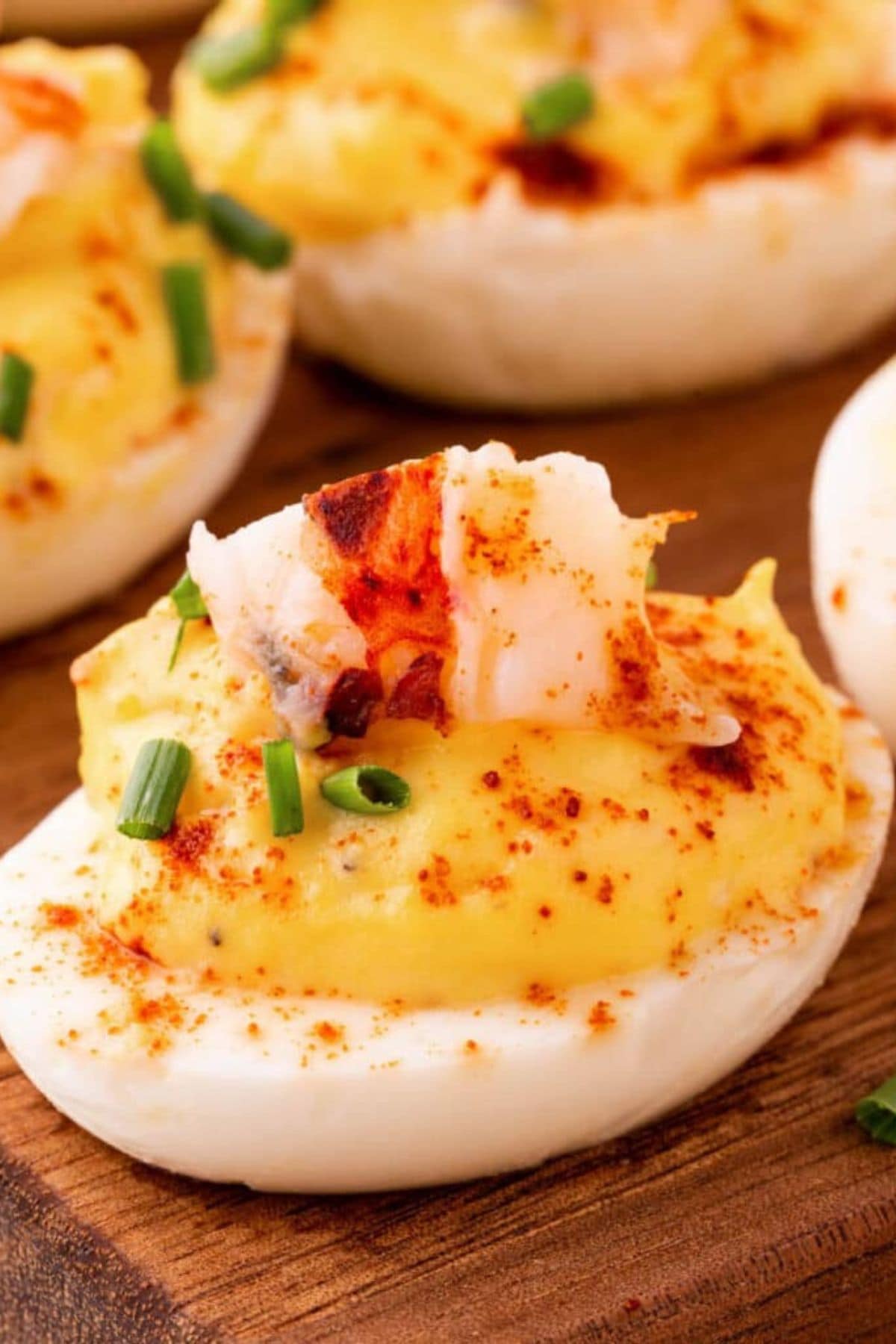 Deviled eggs on cutting board.