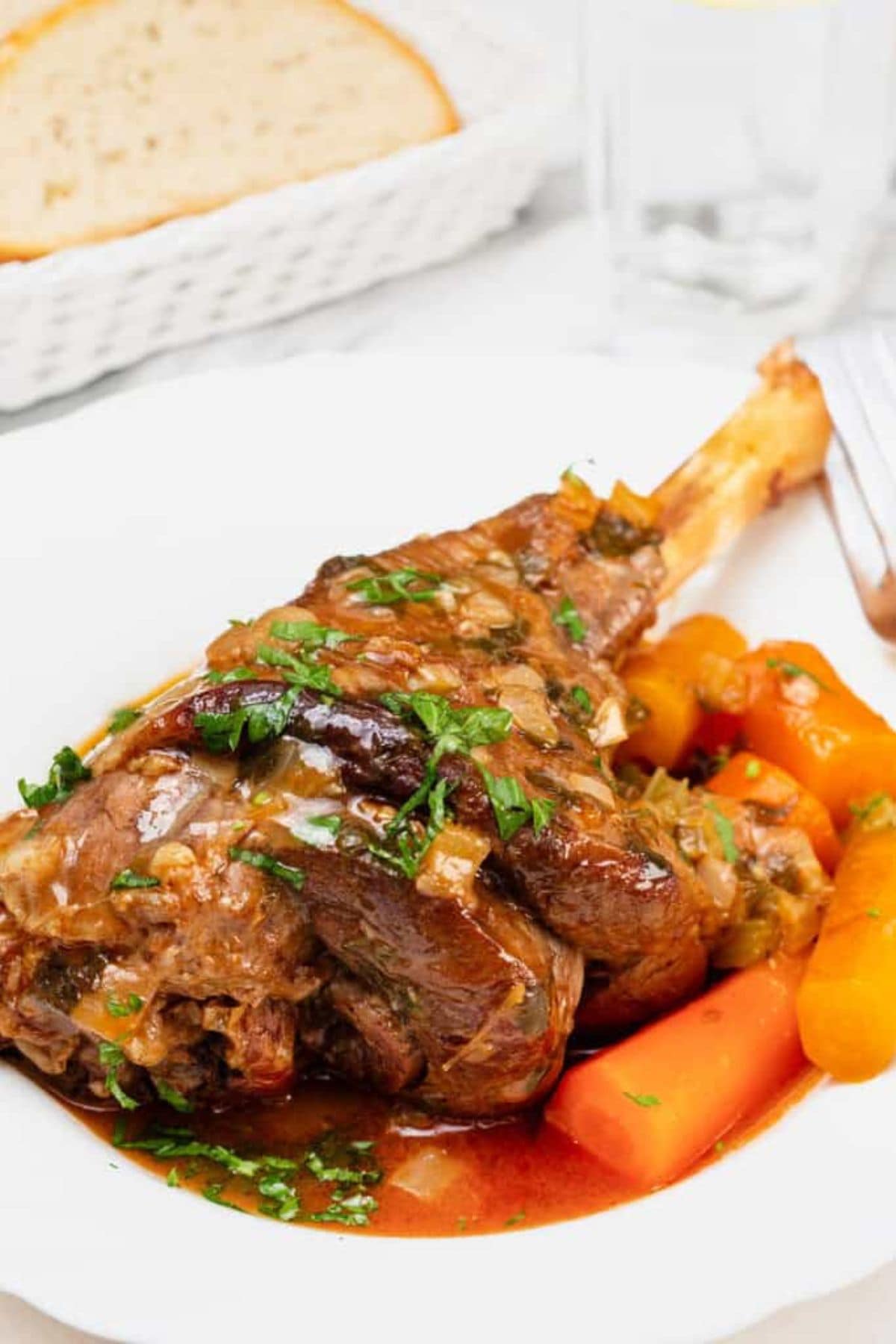 Lamb shank on plate.