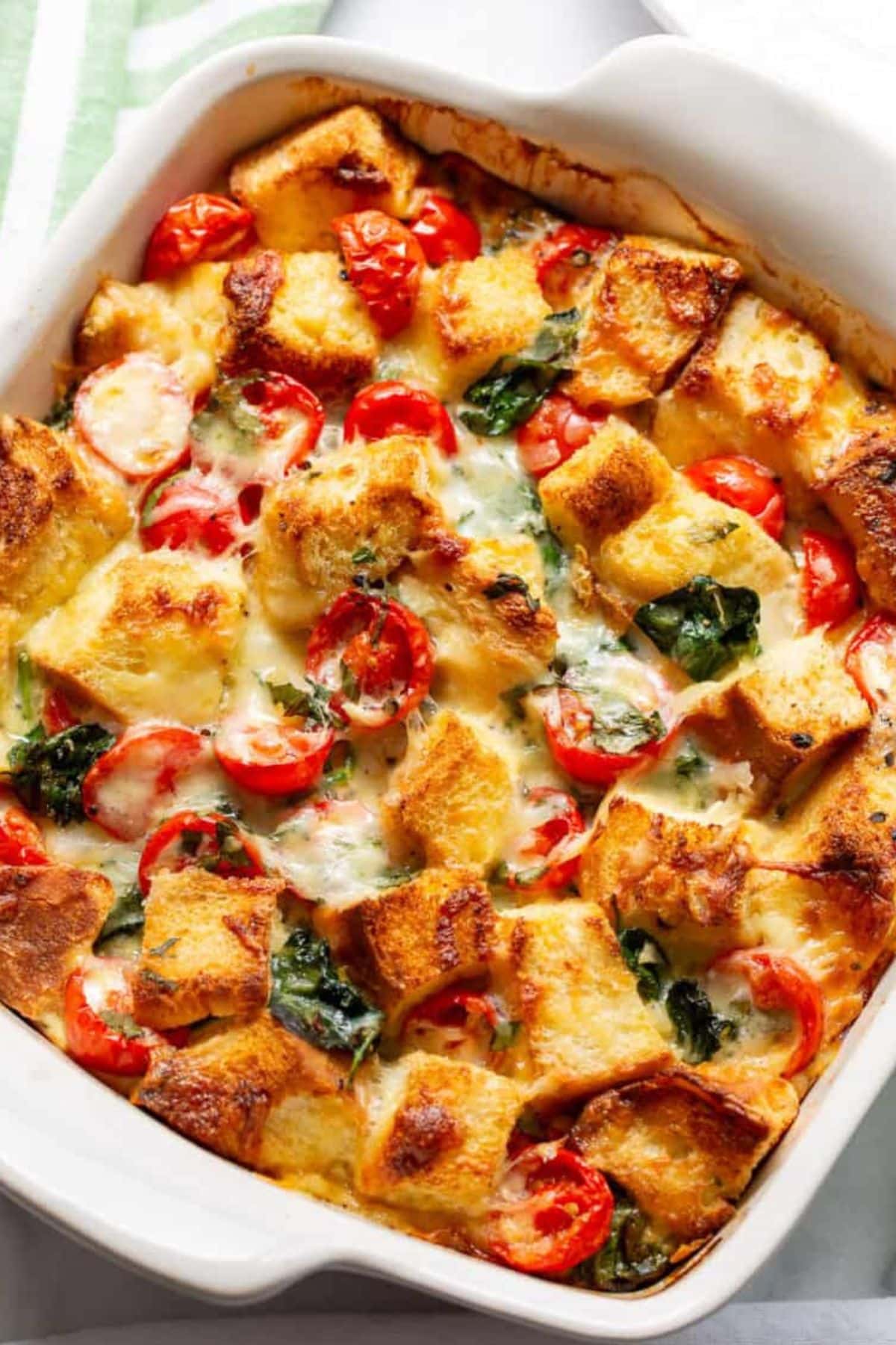 Spinach breakfast strata in dish.