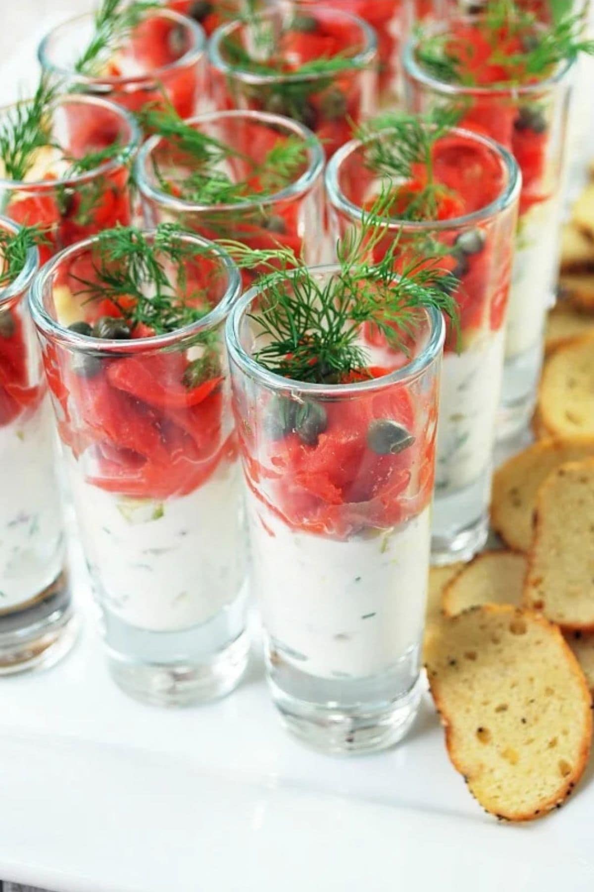 Salmon in shot glasses.