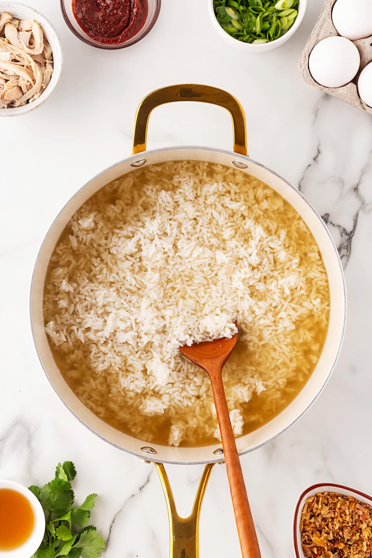 Chicken broth added to rice. 