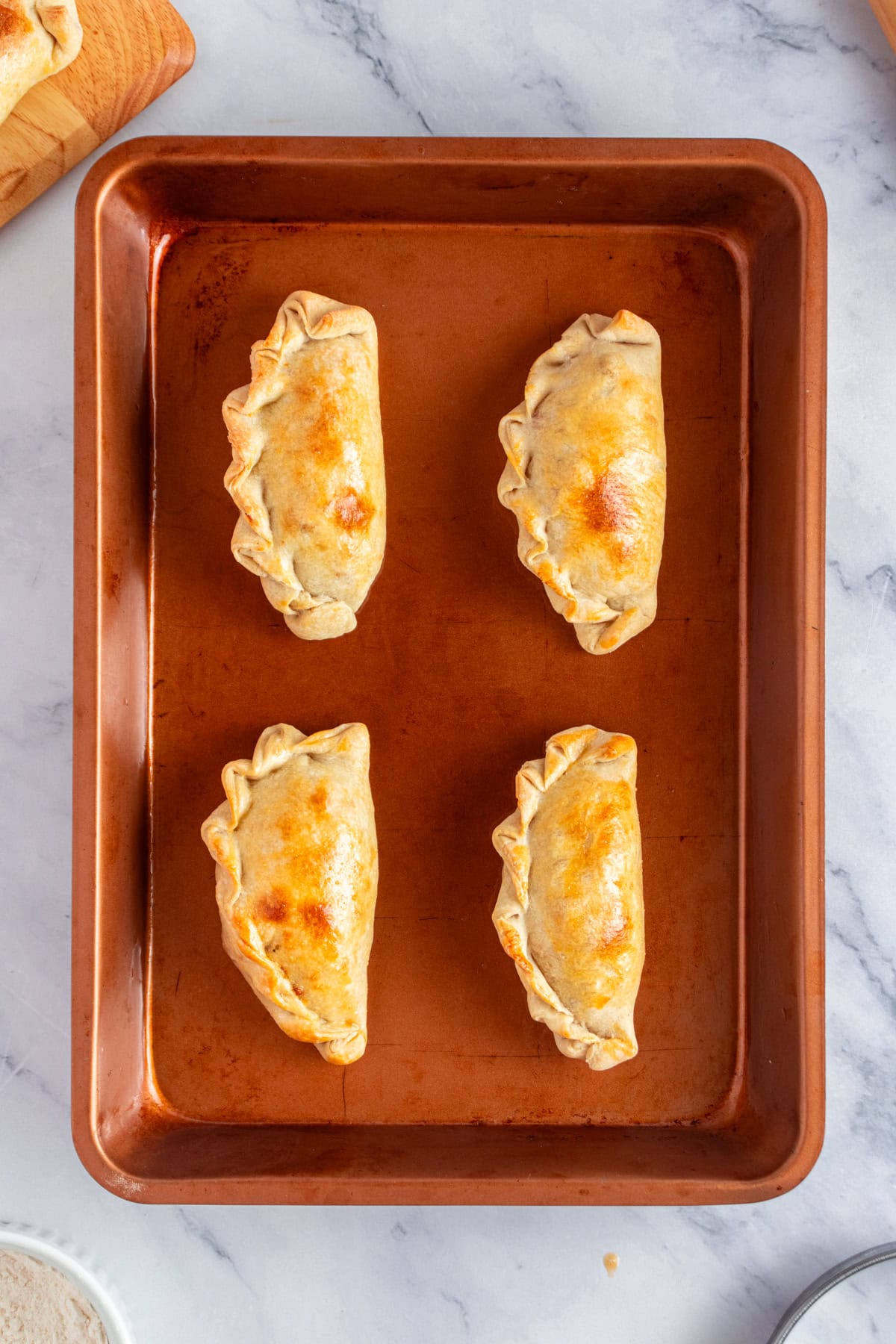 Freshly baked chicken empanadas.