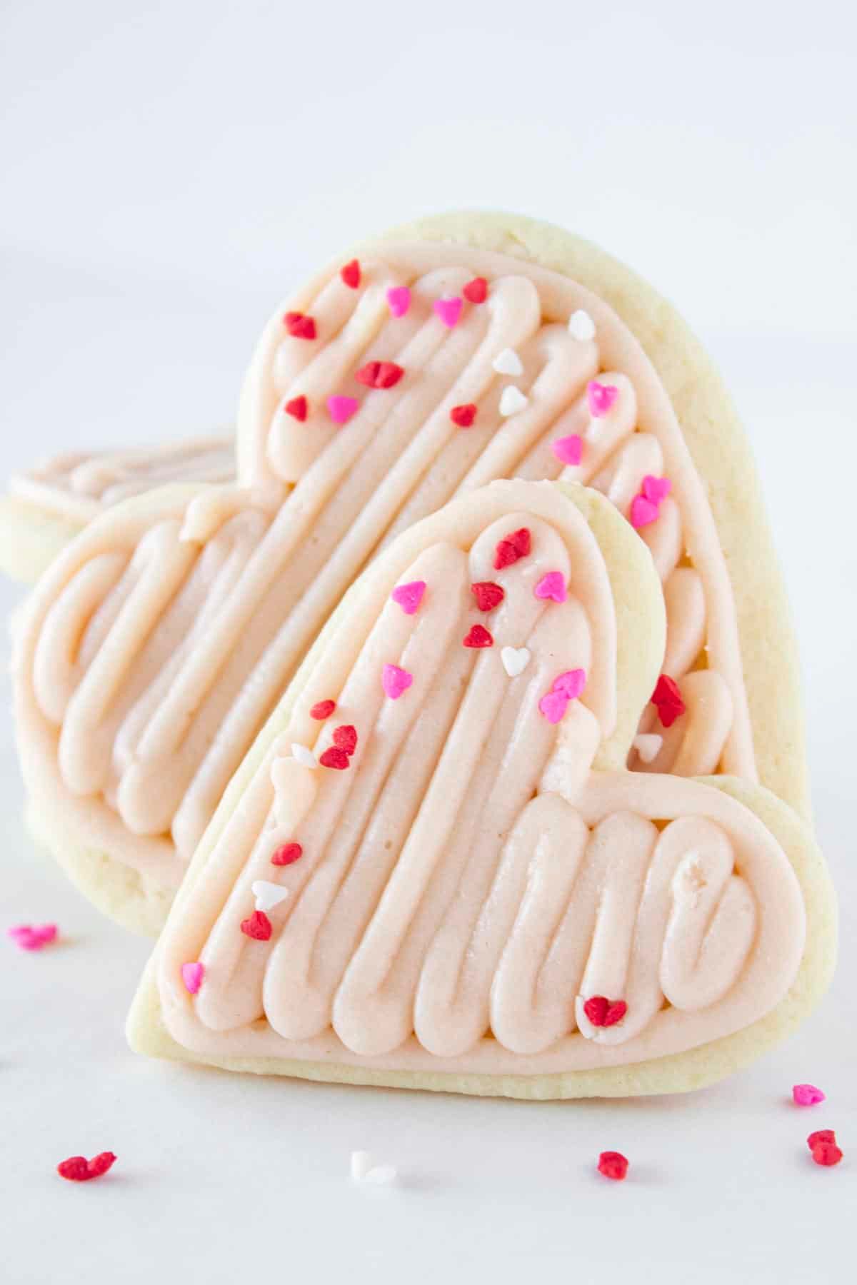 Frosted Heart Cookies on table.