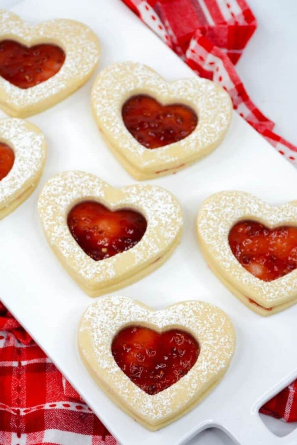 Jam filled cookies on plate.