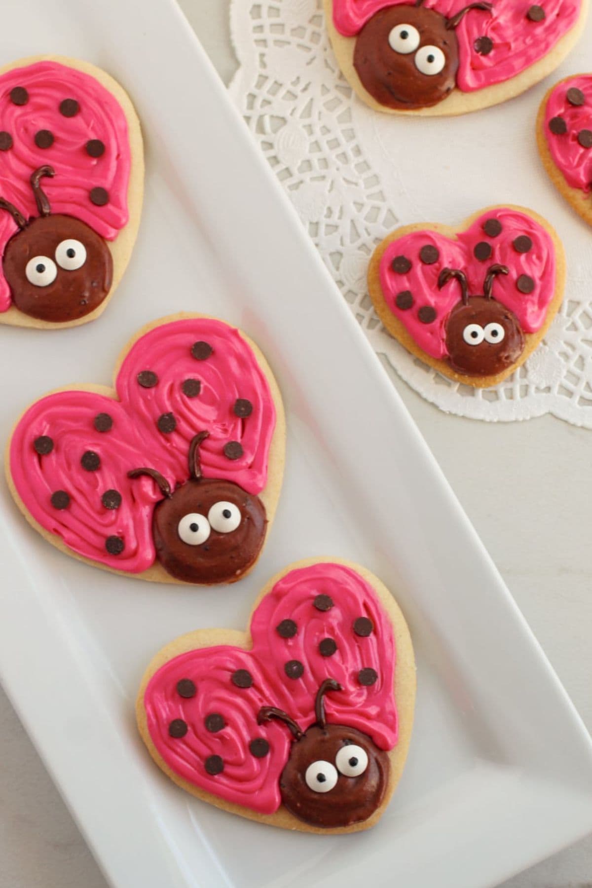 Love bug cookies on a plate.