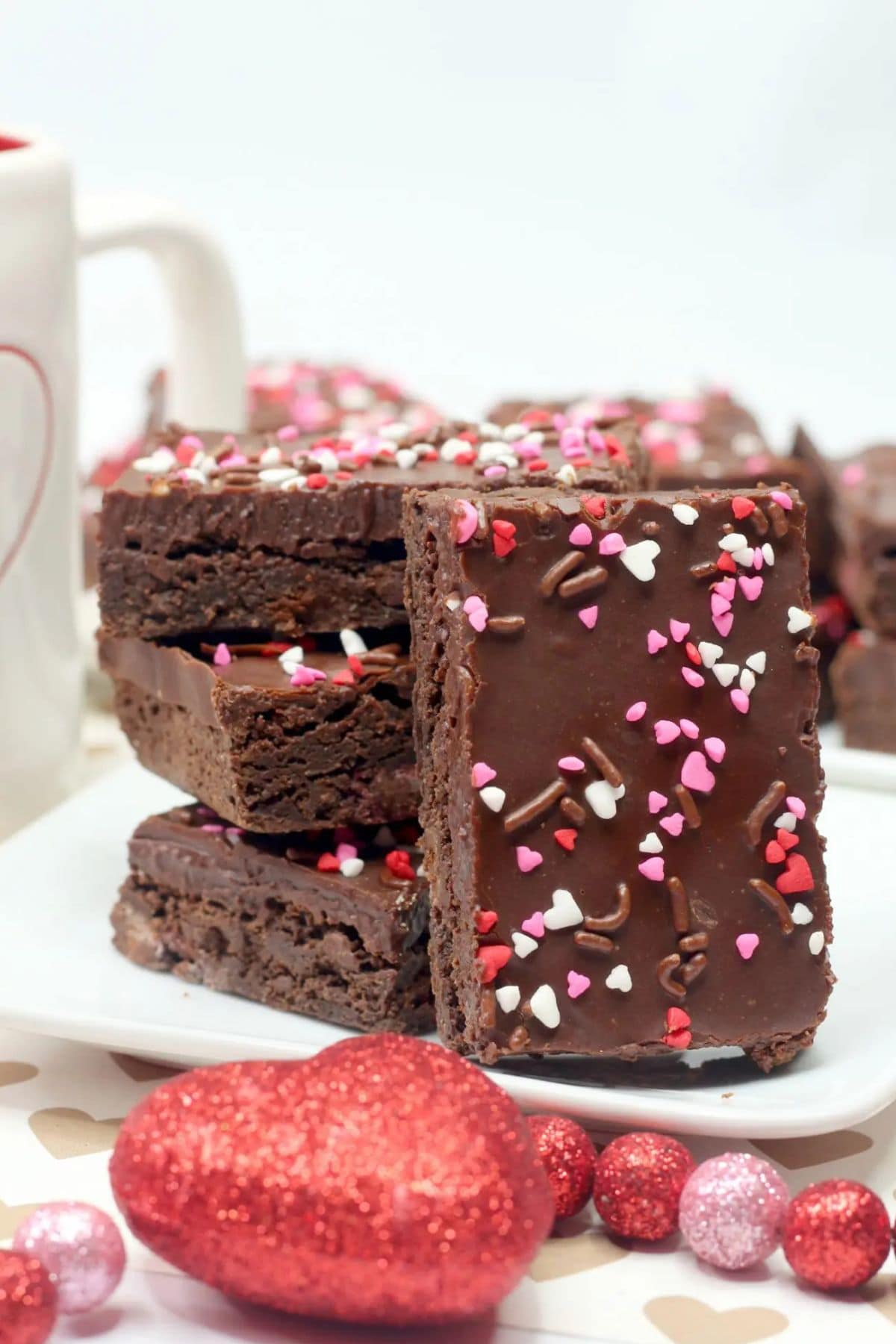 Frosted brownies on a plate.