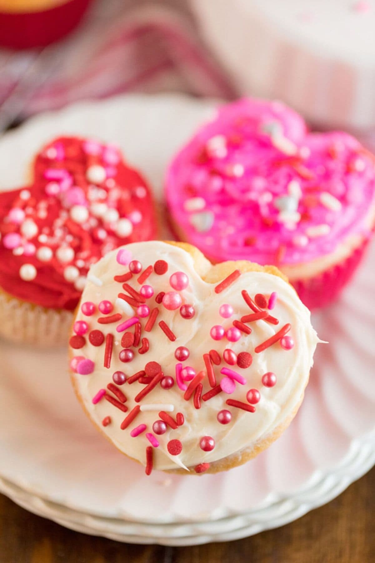 Heart cupcakes on a plate.