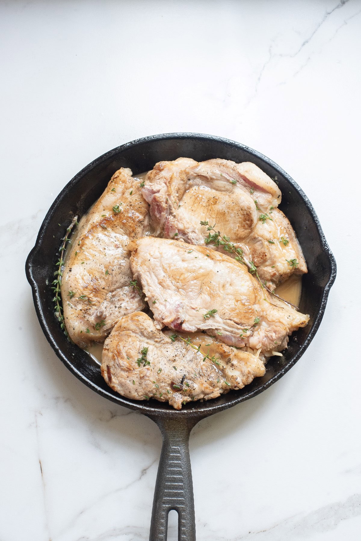 Slightly browned pork chops.