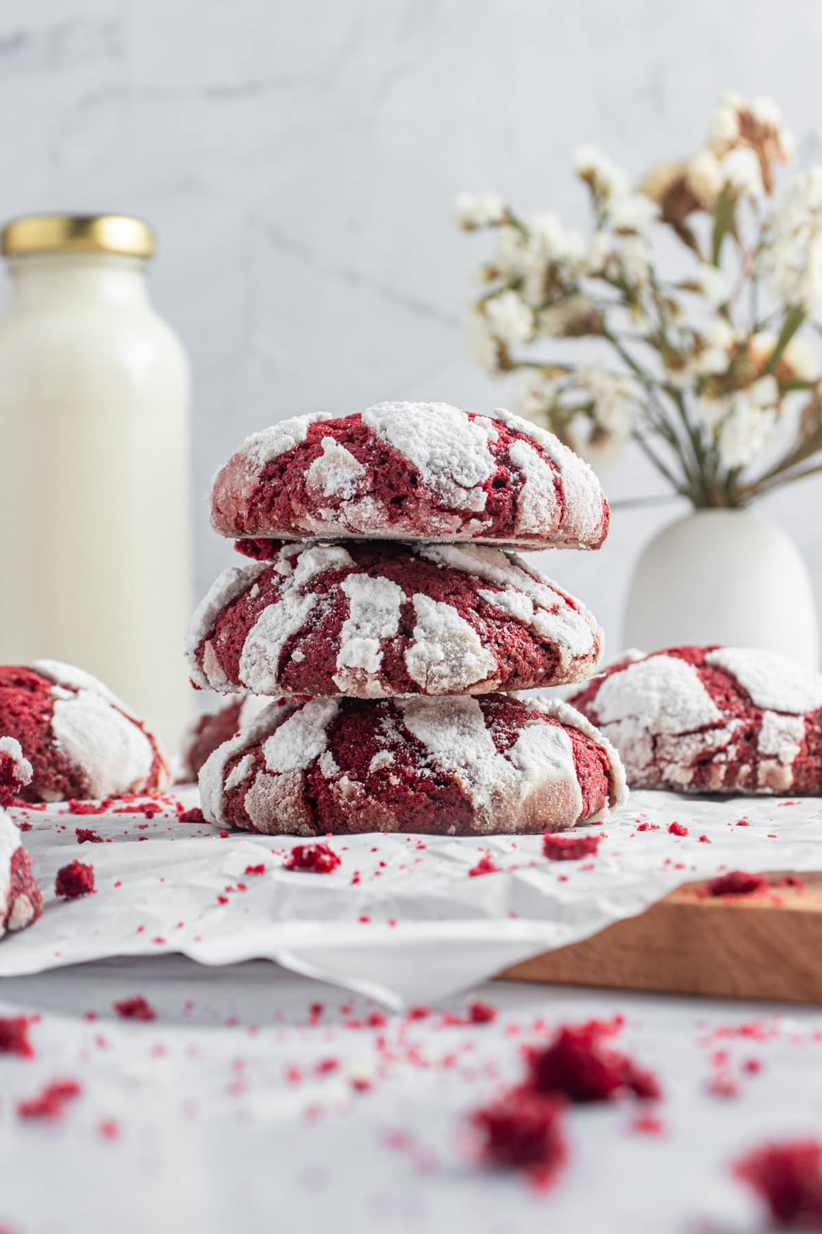 Red velvet crinkle cookies, piled.