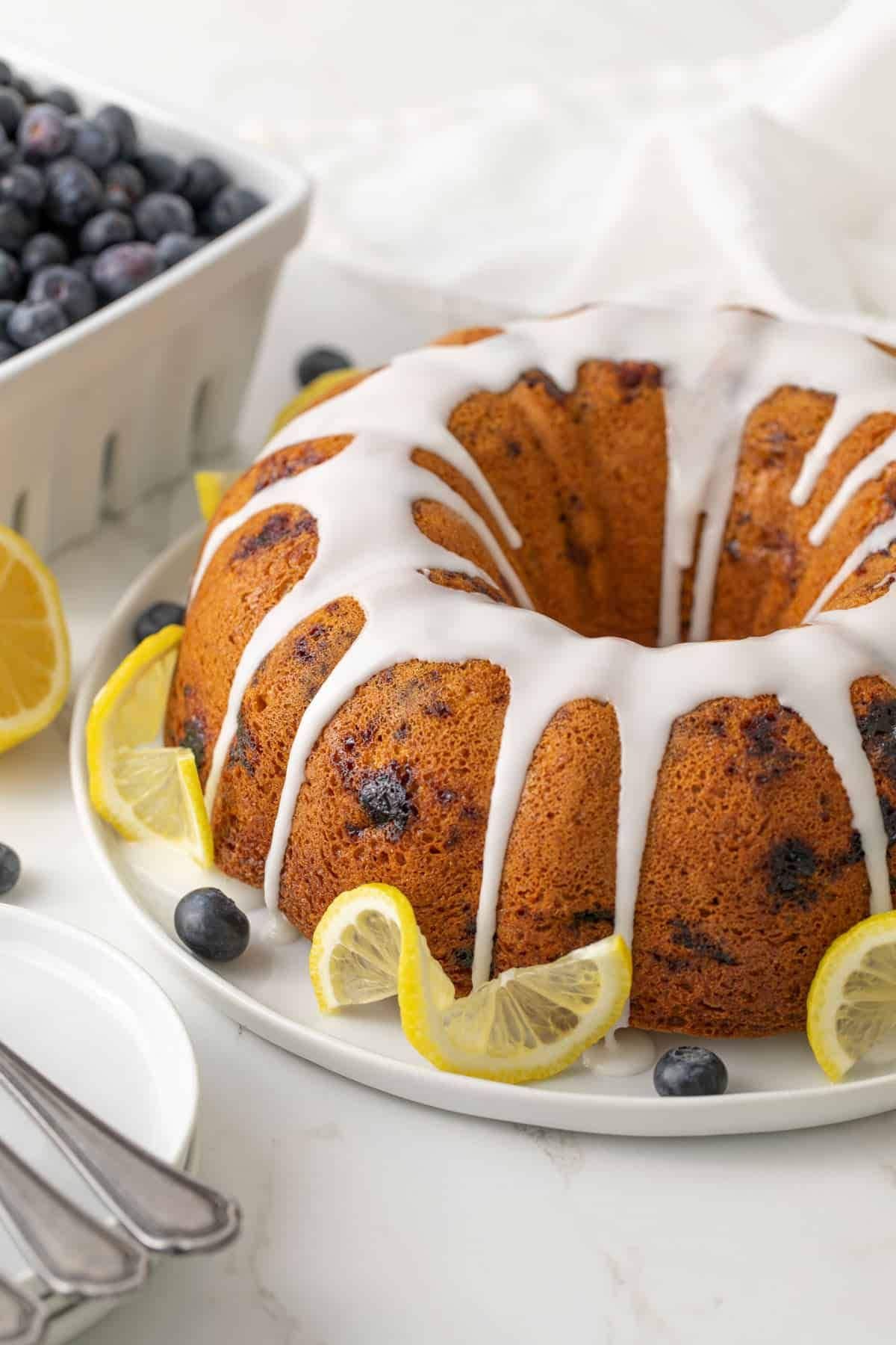 Lemon blueberry cake on a platter.