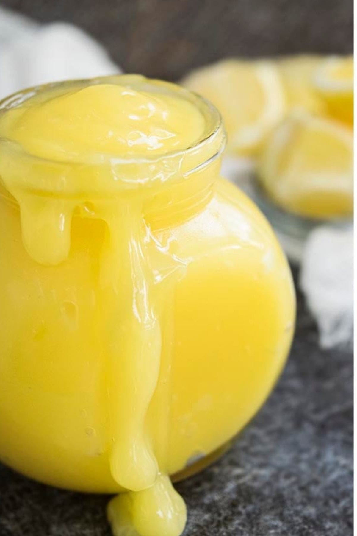 Glass jar full of lemon curd.