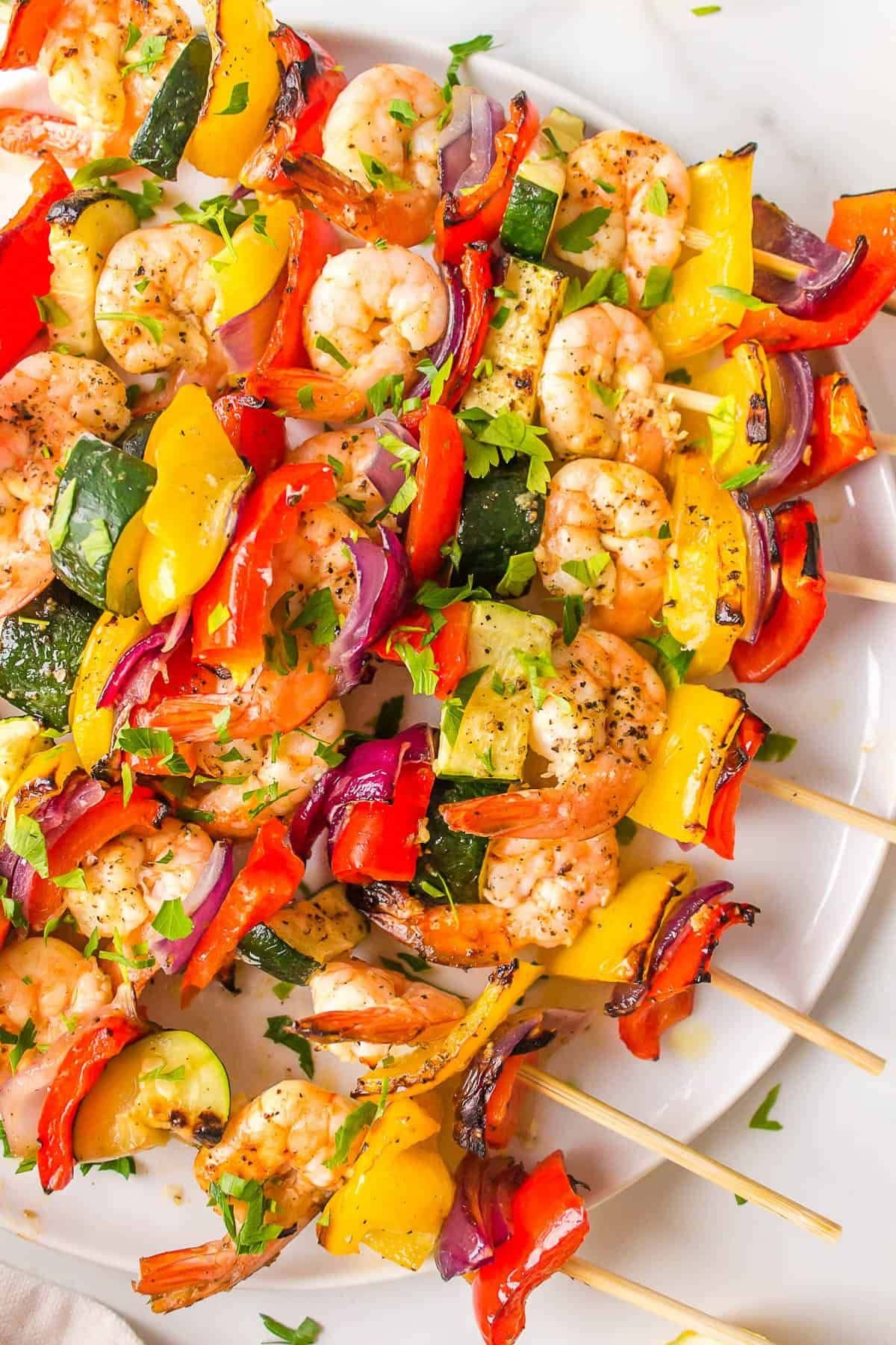 Lemon garlic shrimp kabobs on a platter.