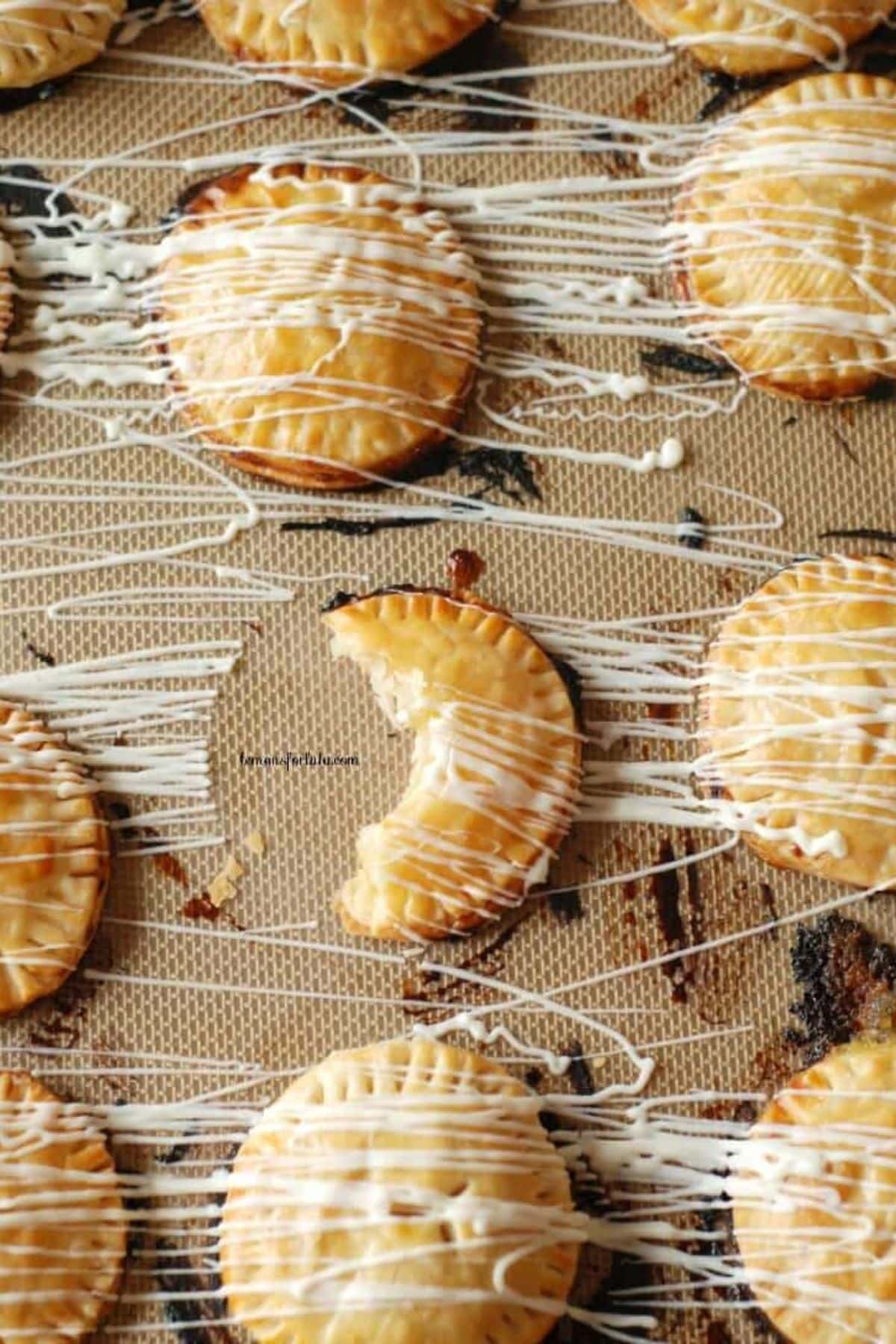 Lemon hand pies on a baking sheet.