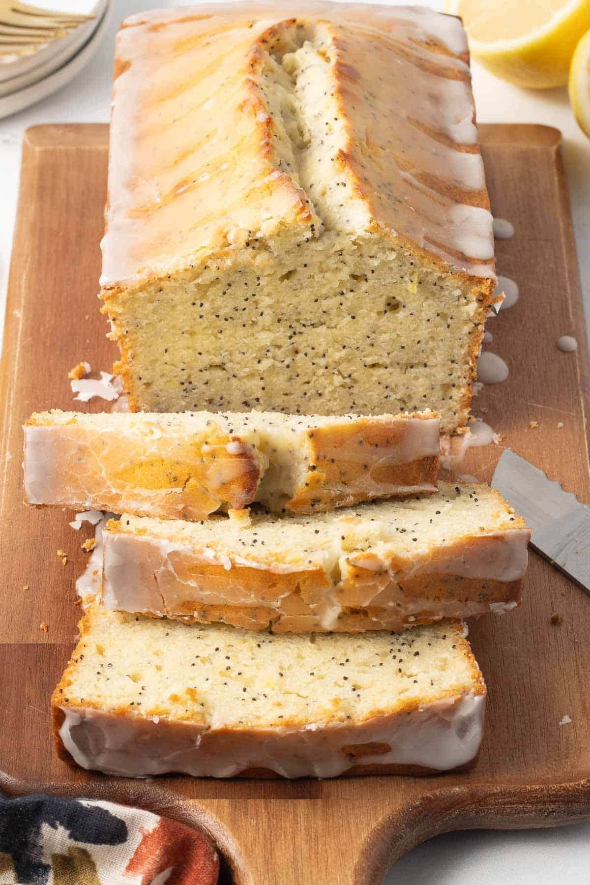 Lemon poppy seed bread on a cutting board.