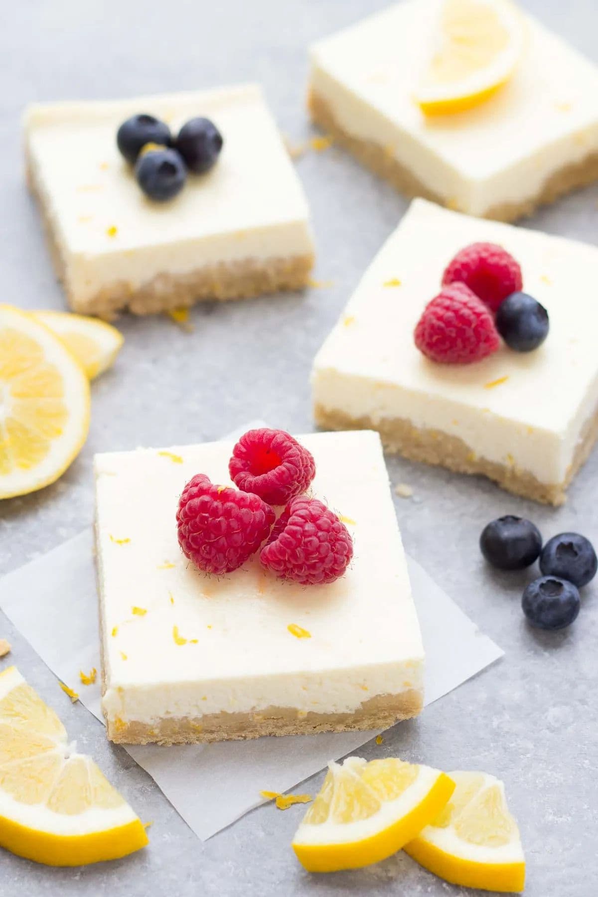 Lemon cheesecake bars on platter.