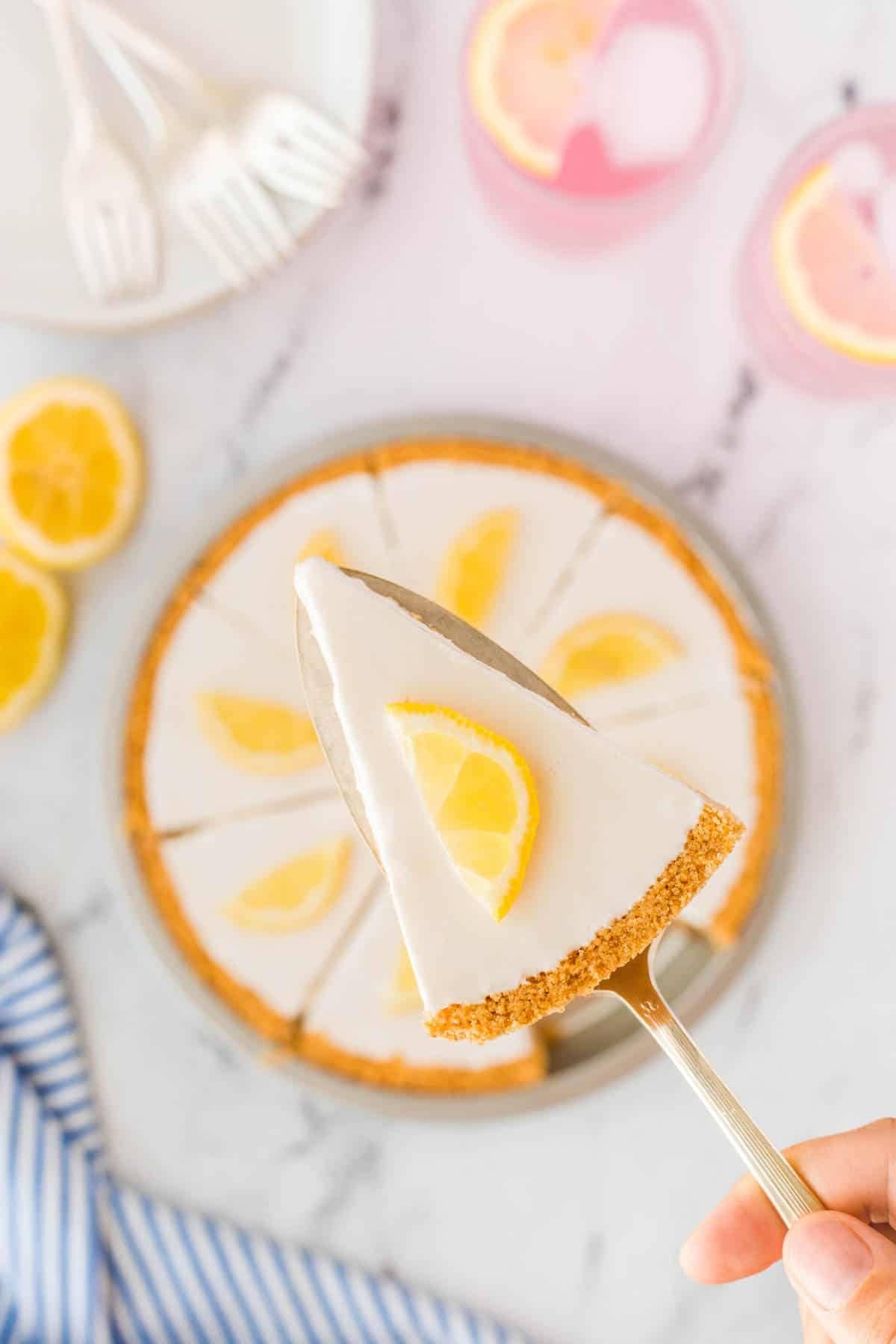 Slice of lemonade pie on spatula.