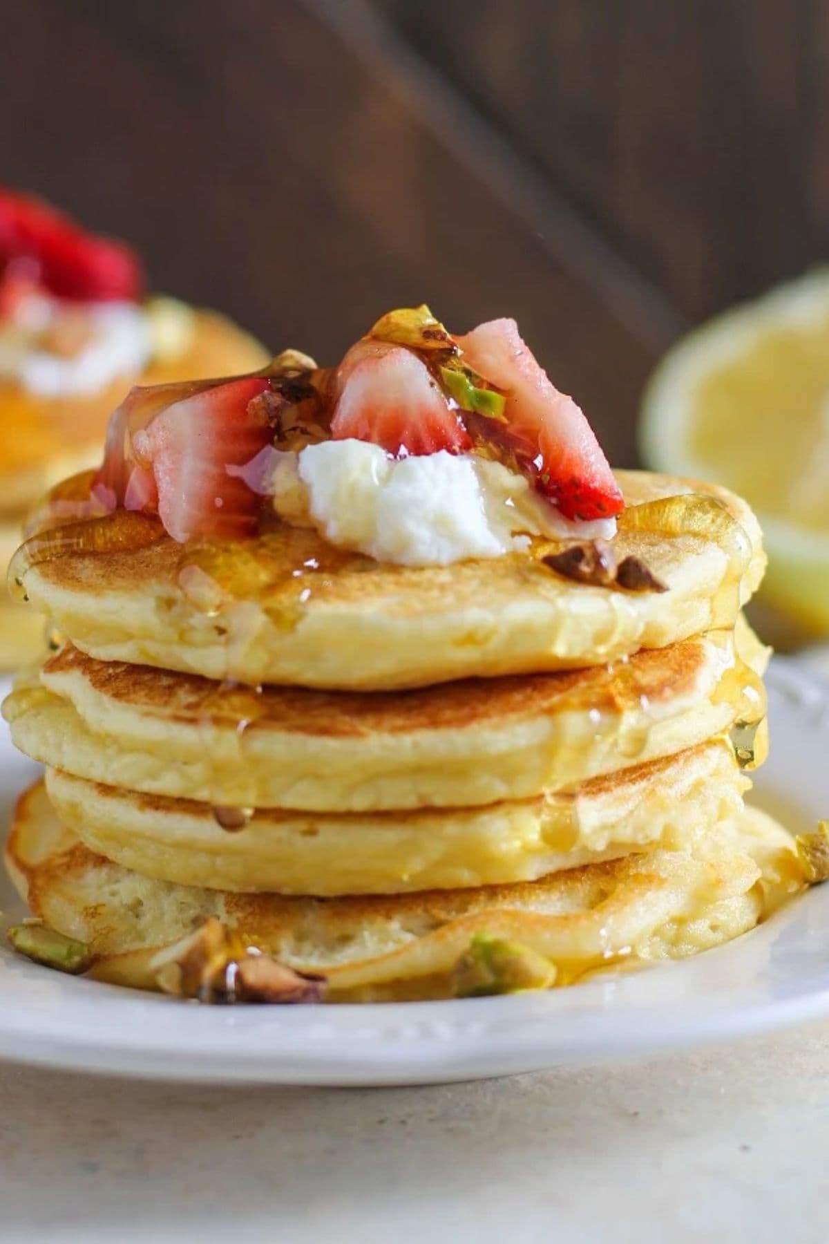 Lemon ricotta pancakes on a plate.