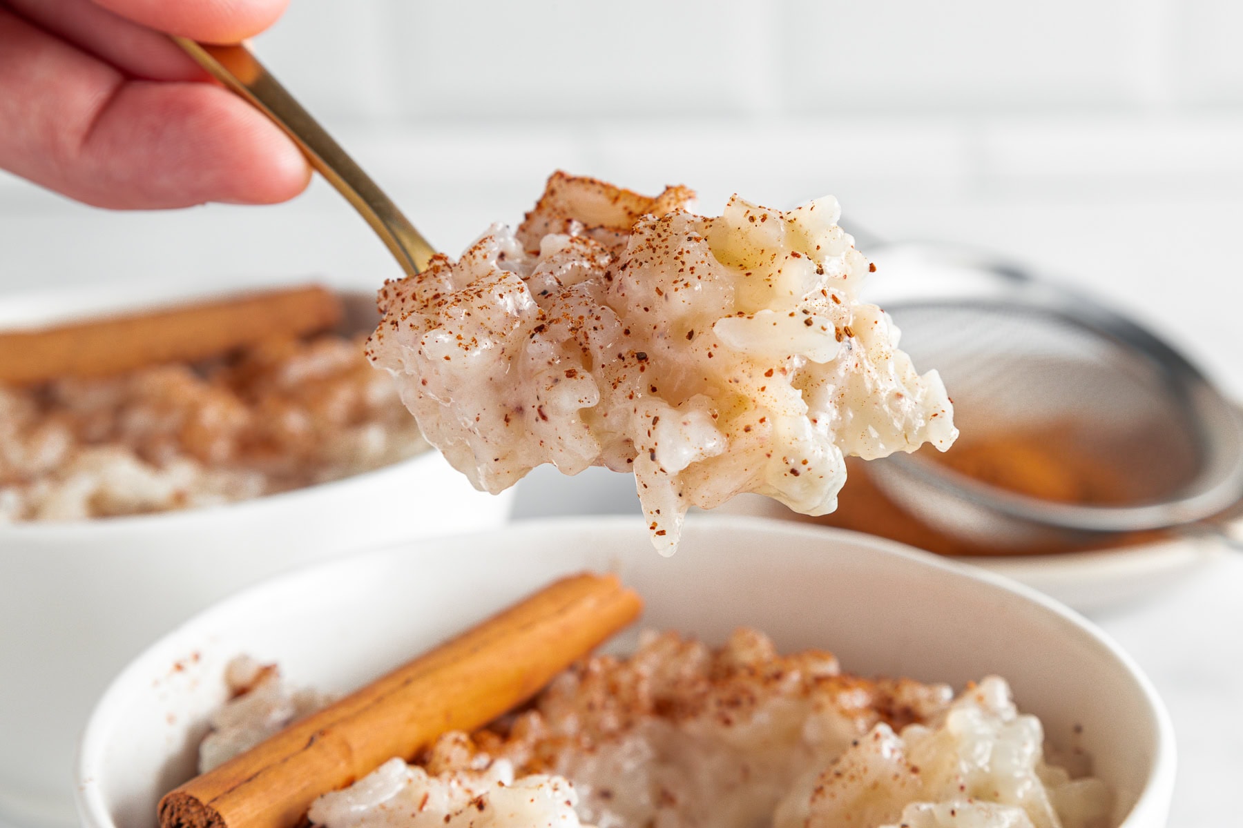 Arroz con leche in a spoon.