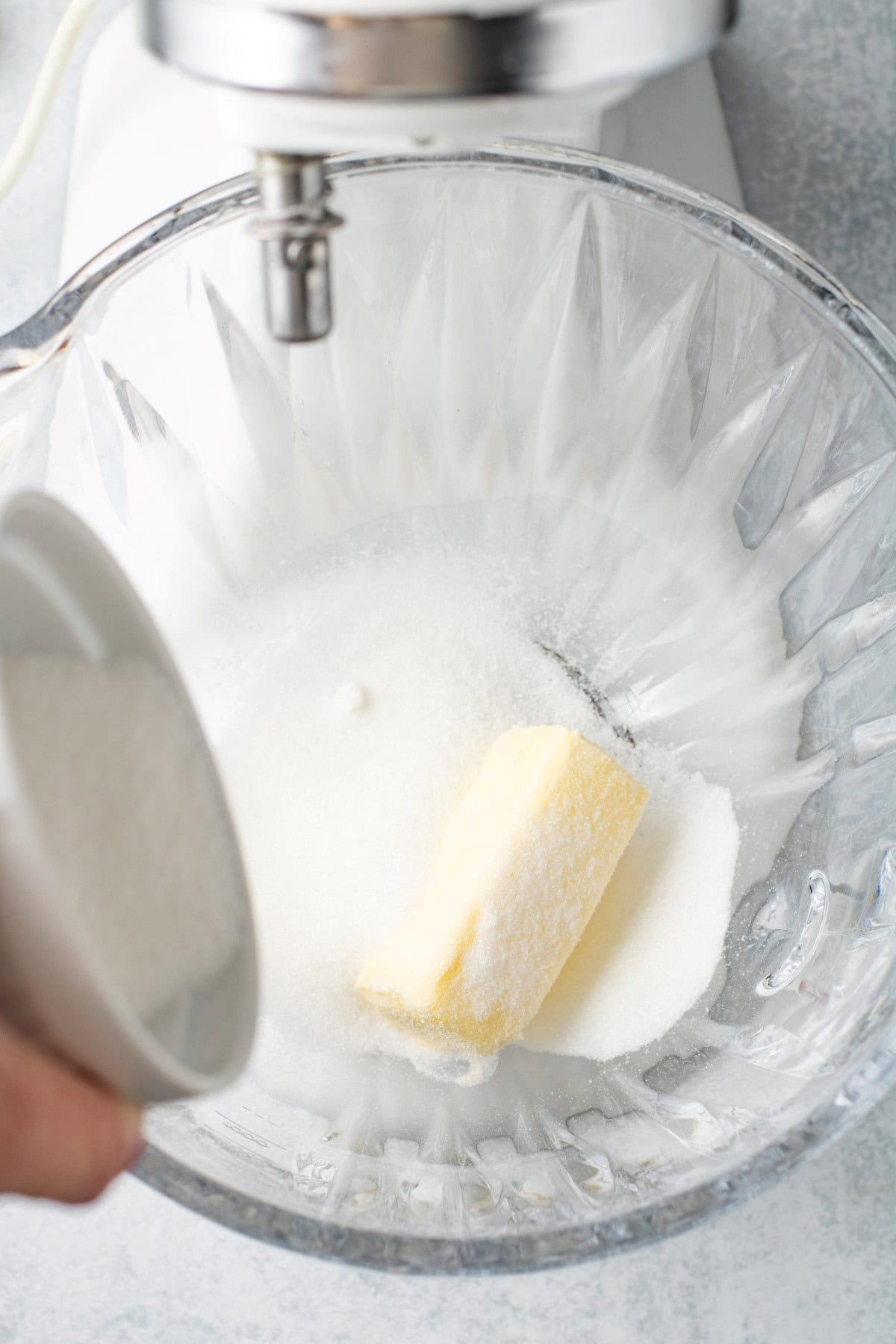 Butter and sugar in a bowl. 