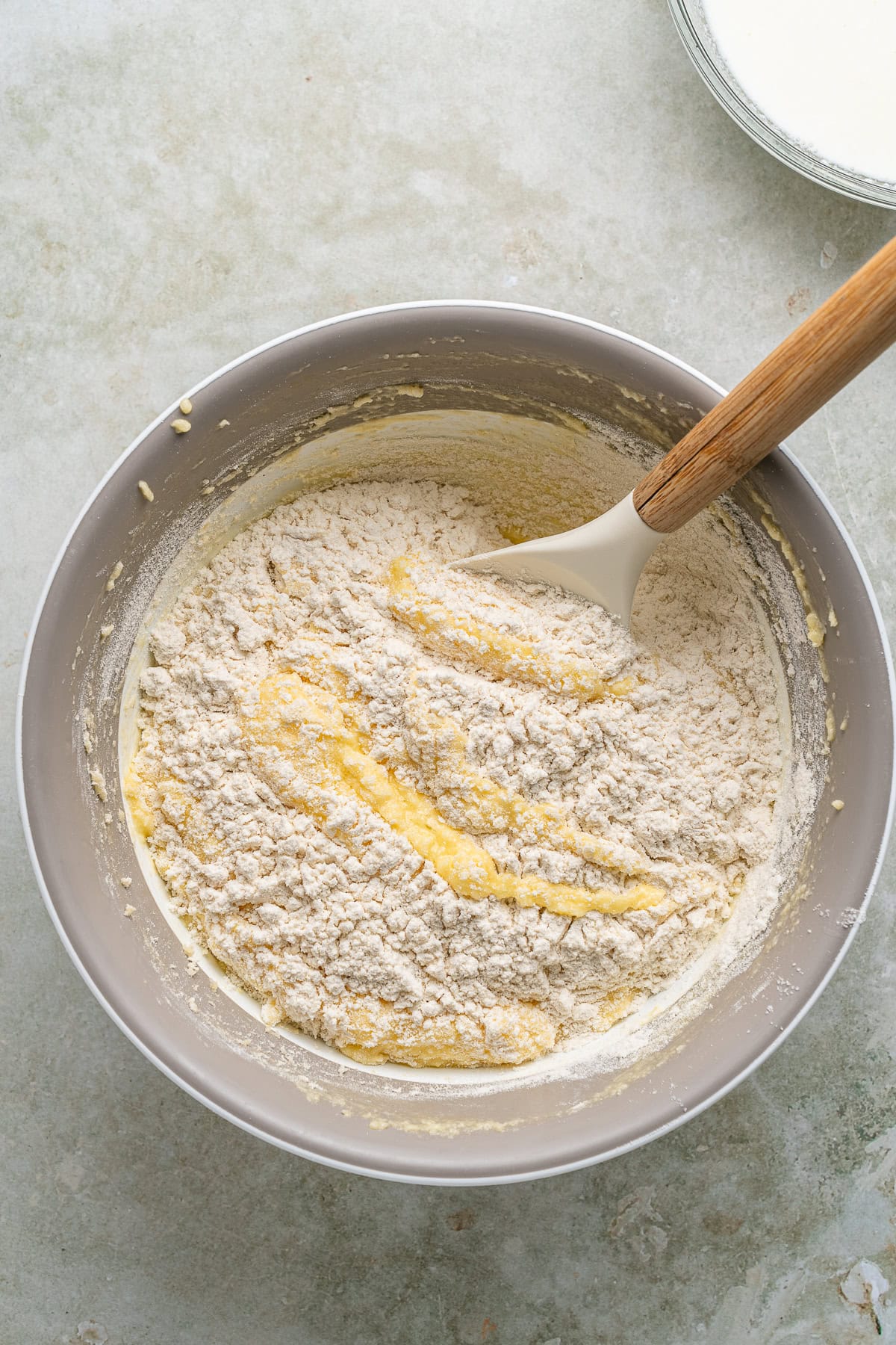 This Limoncello Cake is filled with luscious ingredients like lemon juice, lemon zest and limoncello to give you a lovely citrus flavor to this rich and butter cake. Adding flour.