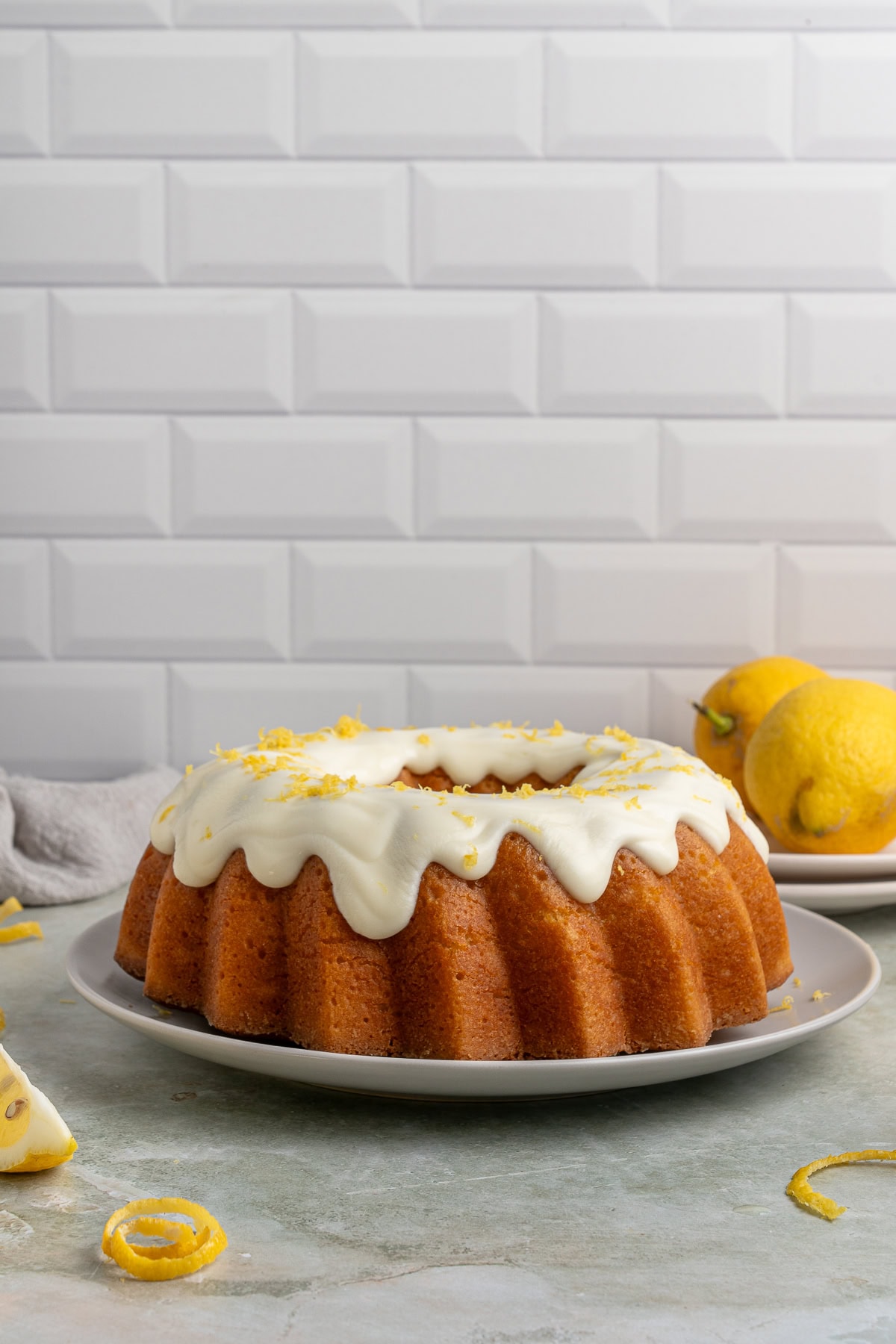 This Limoncello Cake is filled with luscious ingredients like lemon juice, lemon zest and limoncello to give you a lovely citrus flavor to this rich and butter cake. Freshly iced and topped with lemon zest.