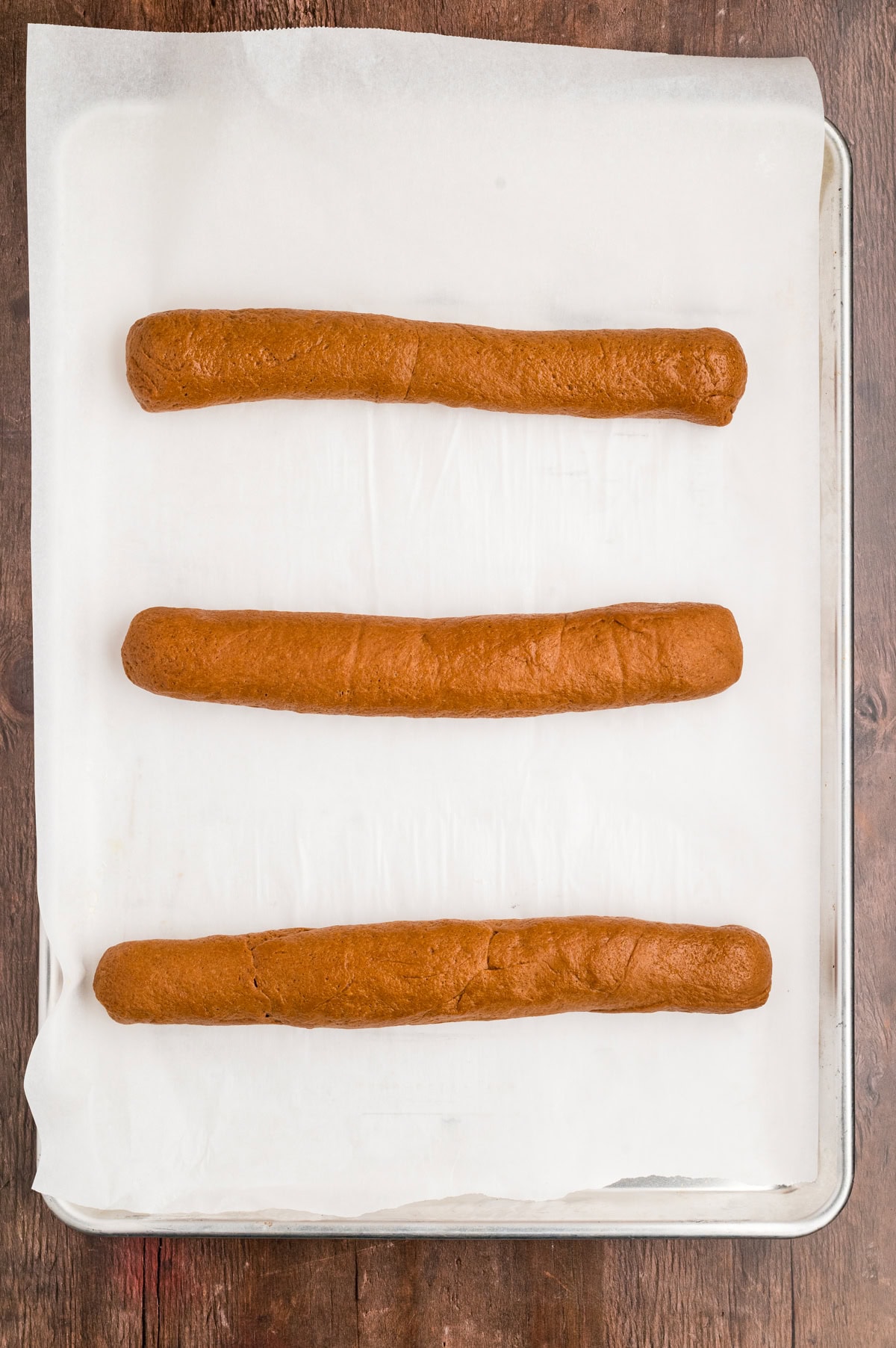 Loaves on baking sheet.