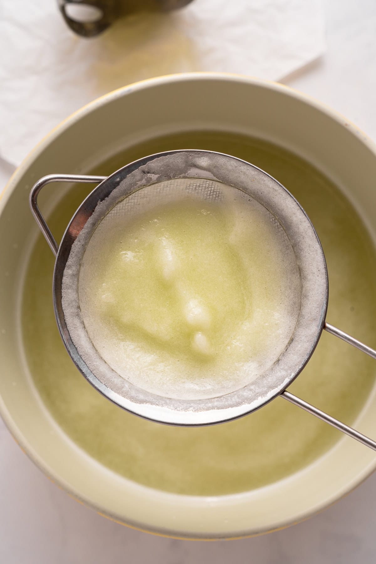 Vodka Cucumber Cocktail is the perfect summer porch sipper on a hot day!! It is easy enough to make for yourself, but perfect for any gathering or BBQ! Your company will rave over it. Straining melon pulp.