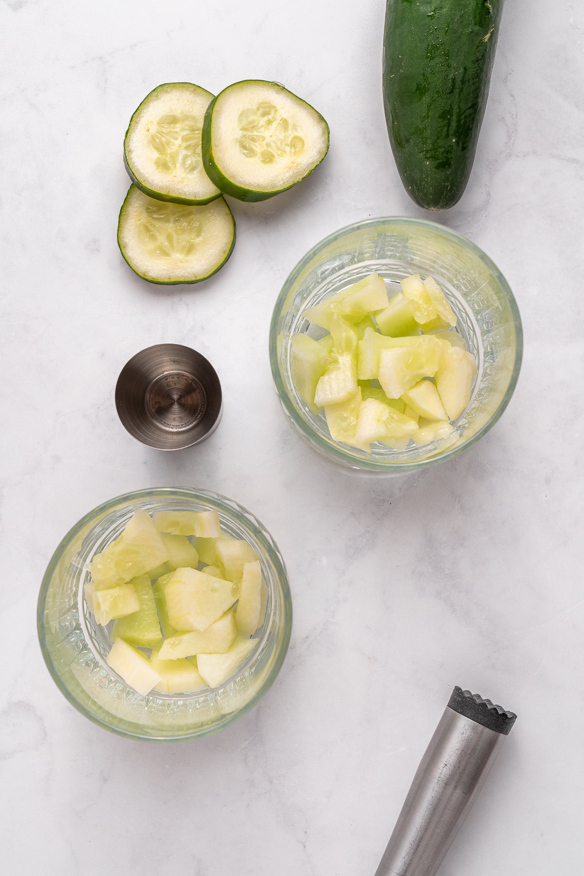 Vodka Cucumber Cocktail is the perfect summer porch sipper on a hot day!! It is easy enough to make for yourself, but perfect for any gathering or BBQ! Your company will rave over it. Making cucumber cocktails.