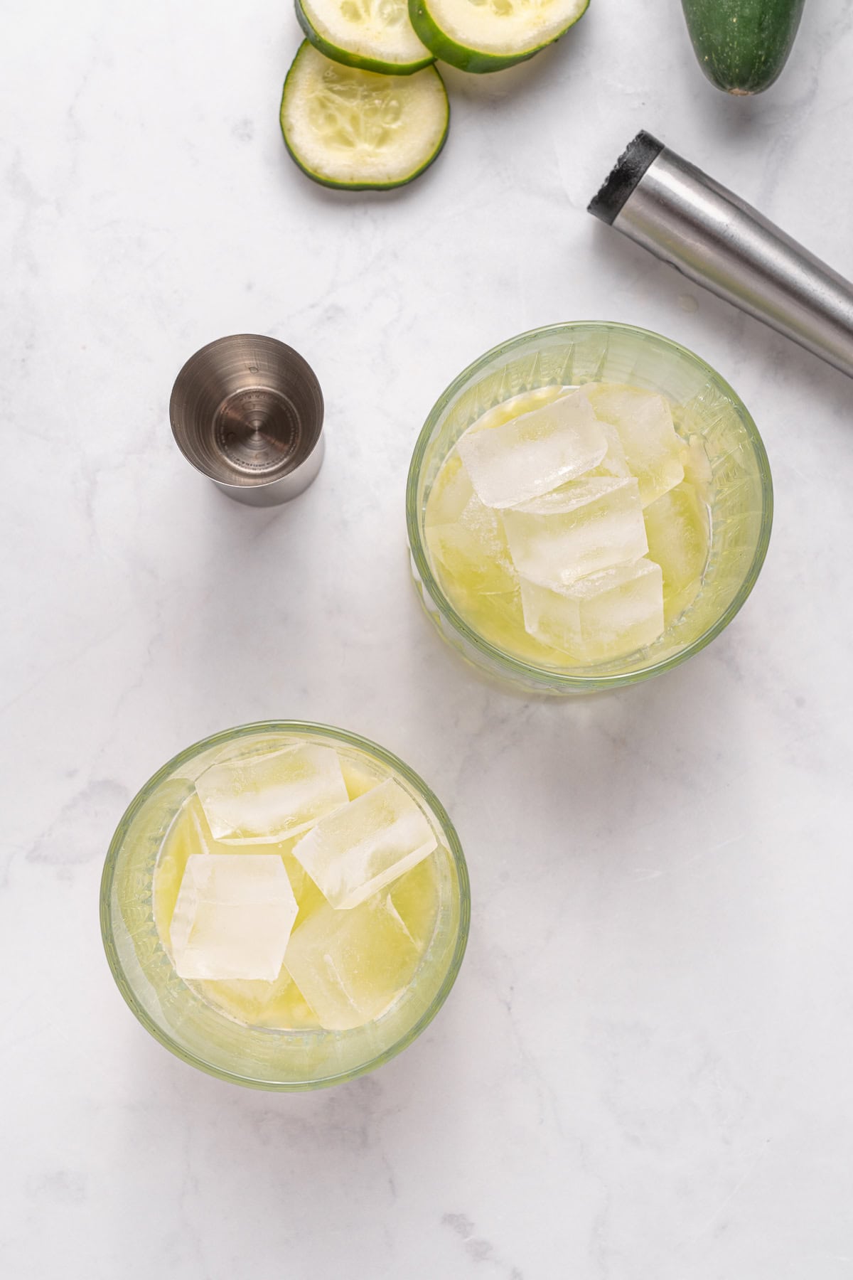 Vodka Cucumber Cocktail is the perfect summer porch sipper on a hot day!! It is easy enough to make for yourself, but perfect for any gathering or BBQ! Your company will rave over it. Adding ice cubes.