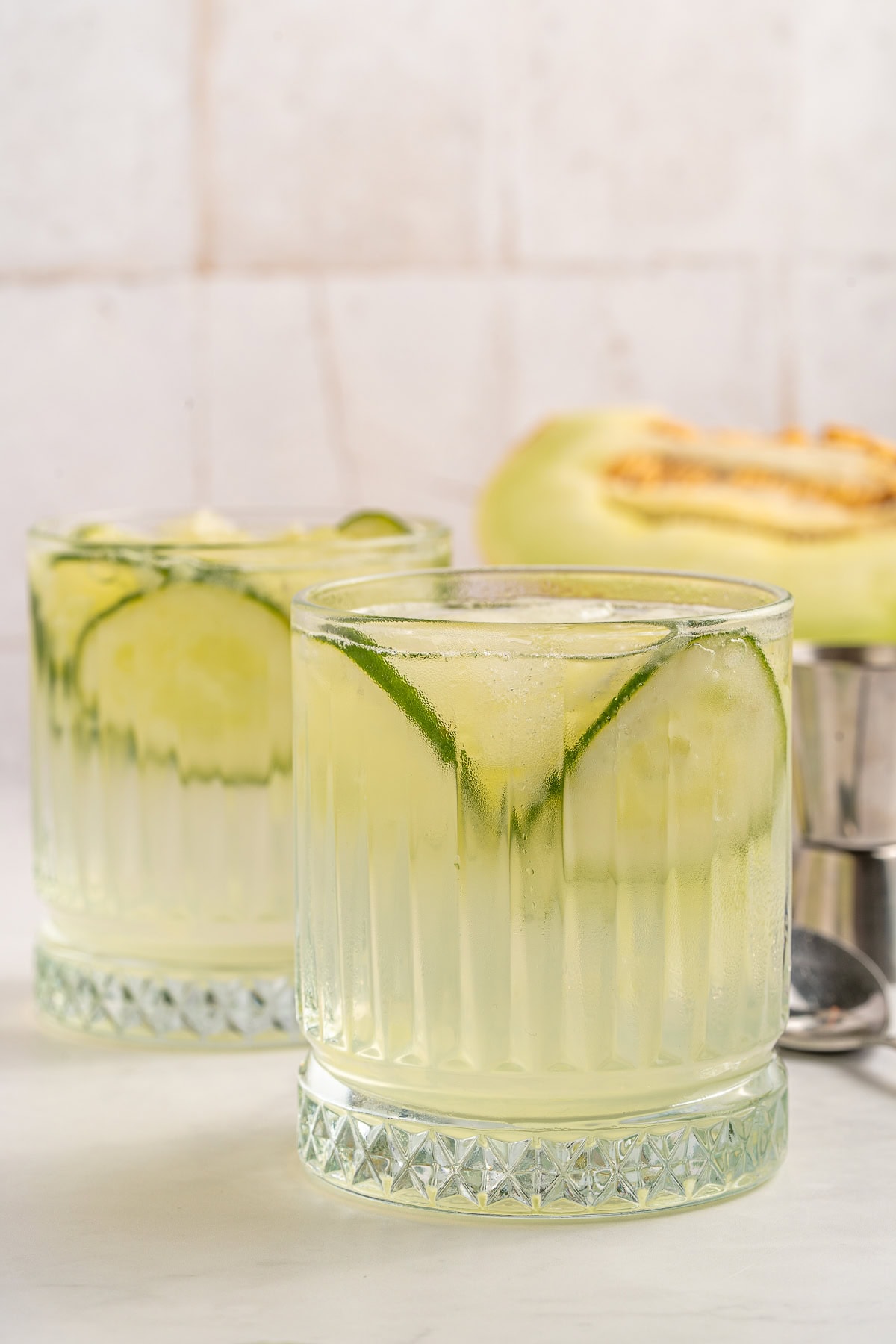 Vodka Cucumber Cocktail is the perfect summer porch sipper on a hot day!! It is easy enough to make for yourself, but perfect for any gathering or BBQ! Your company will rave over it. Vodka cucumber cocktail, served.