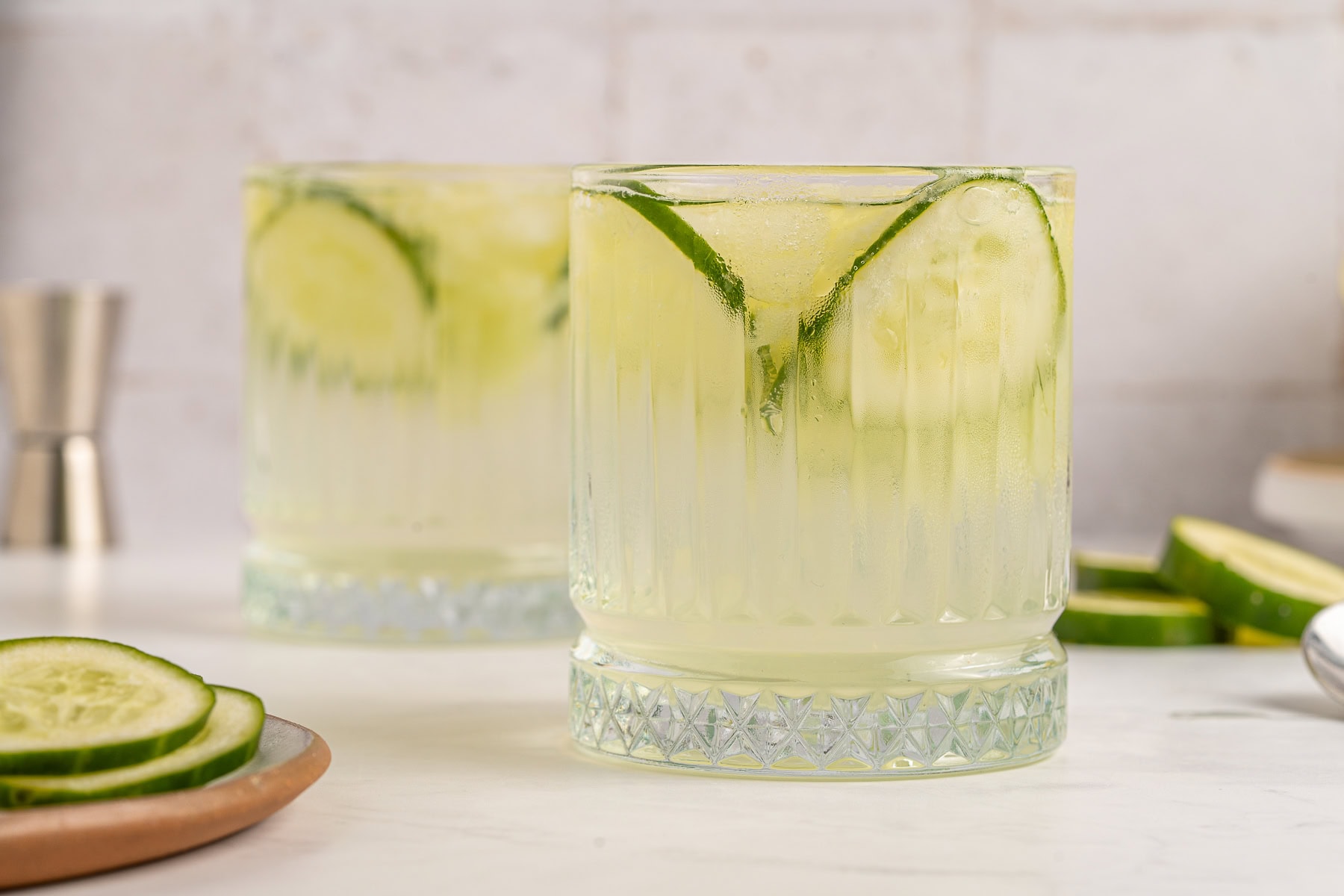 Vodka Cucumber Cocktail is the perfect summer porch sipper on a hot day!! It is easy enough to make for yourself, but perfect for any gathering or BBQ! Your company will rave over it. Refreshing cucumber cocktail.