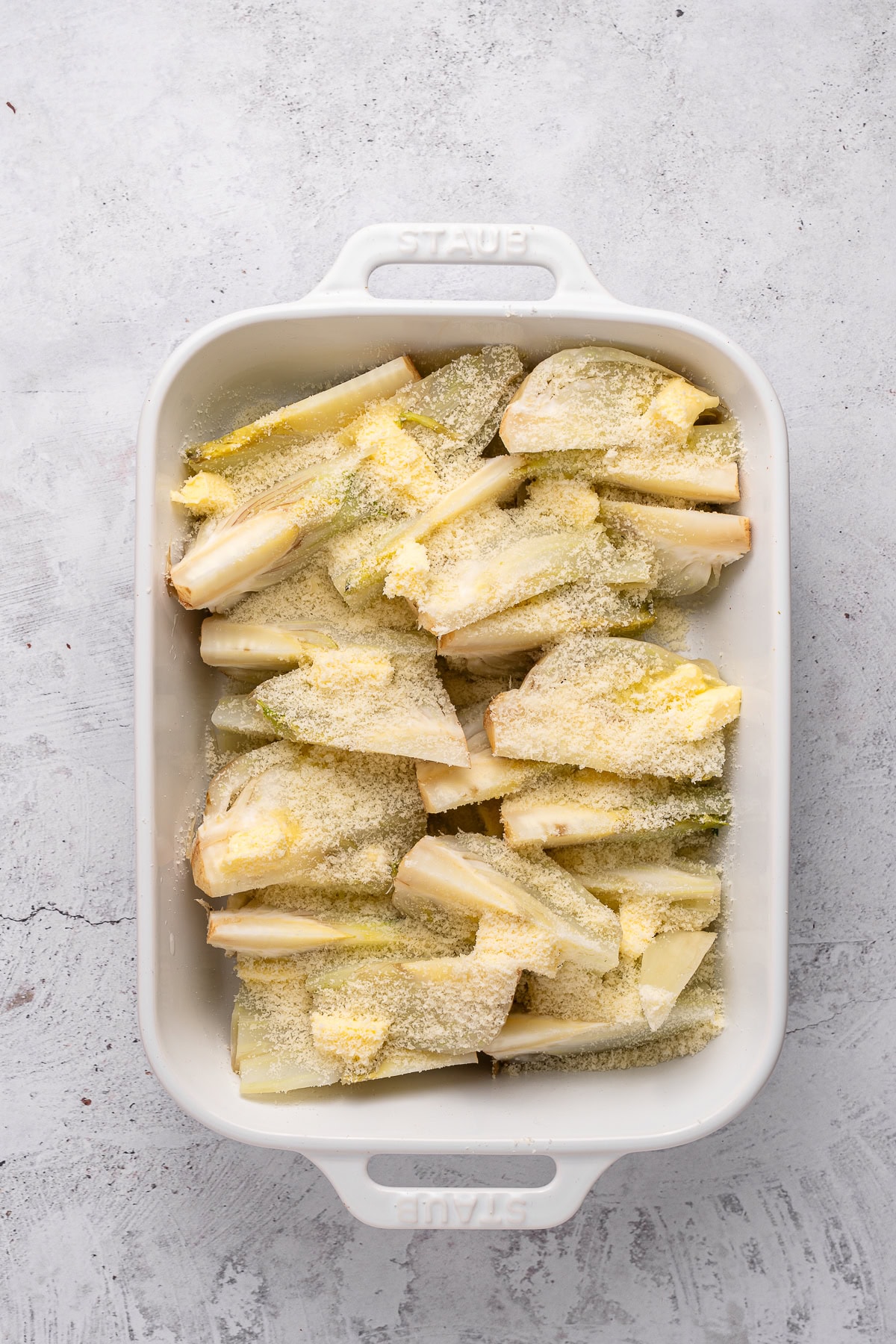 This recipe for Baked Fennel With Parmesan Cheese is unique and delicious. Baking fennel makes it mellow, and the butter and cheese make it excellent. Chopped fennel with butter and parmesan cheese.