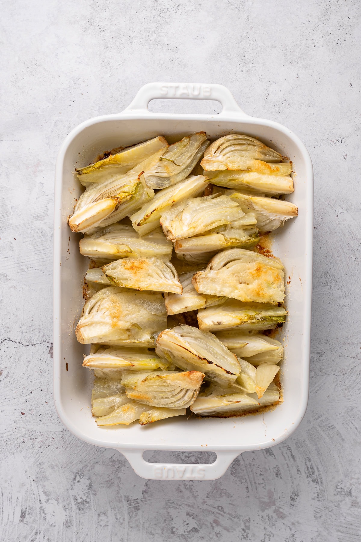 This recipe for Baked Fennel With Parmesan Cheese is unique and delicious. Baking fennel makes it mellow, and the butter and cheese make it excellent. Baked fennel with parmesan cheese.