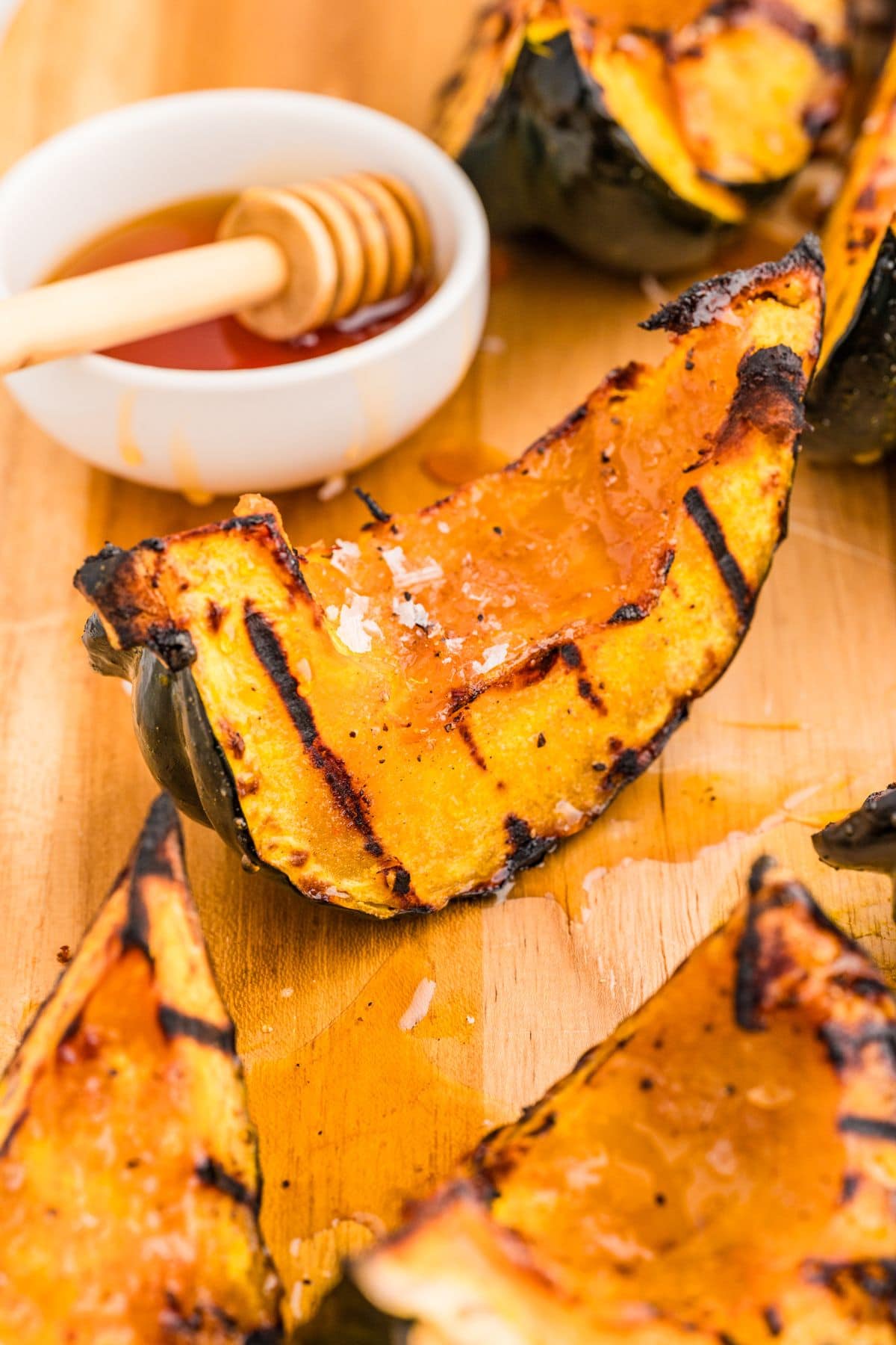 Grilled squash on cutting board.