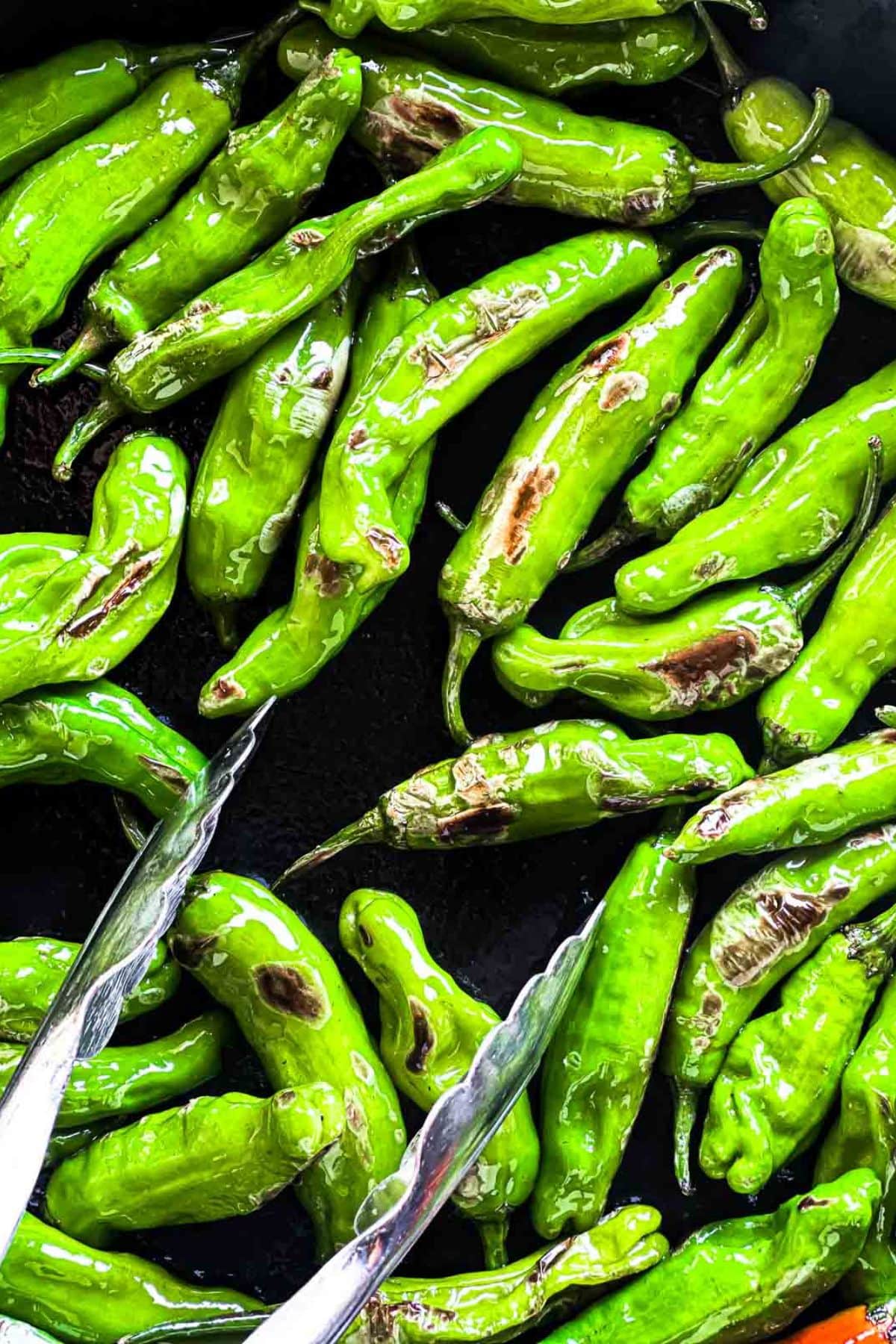 Grilled peppers in a cast iron skillet.