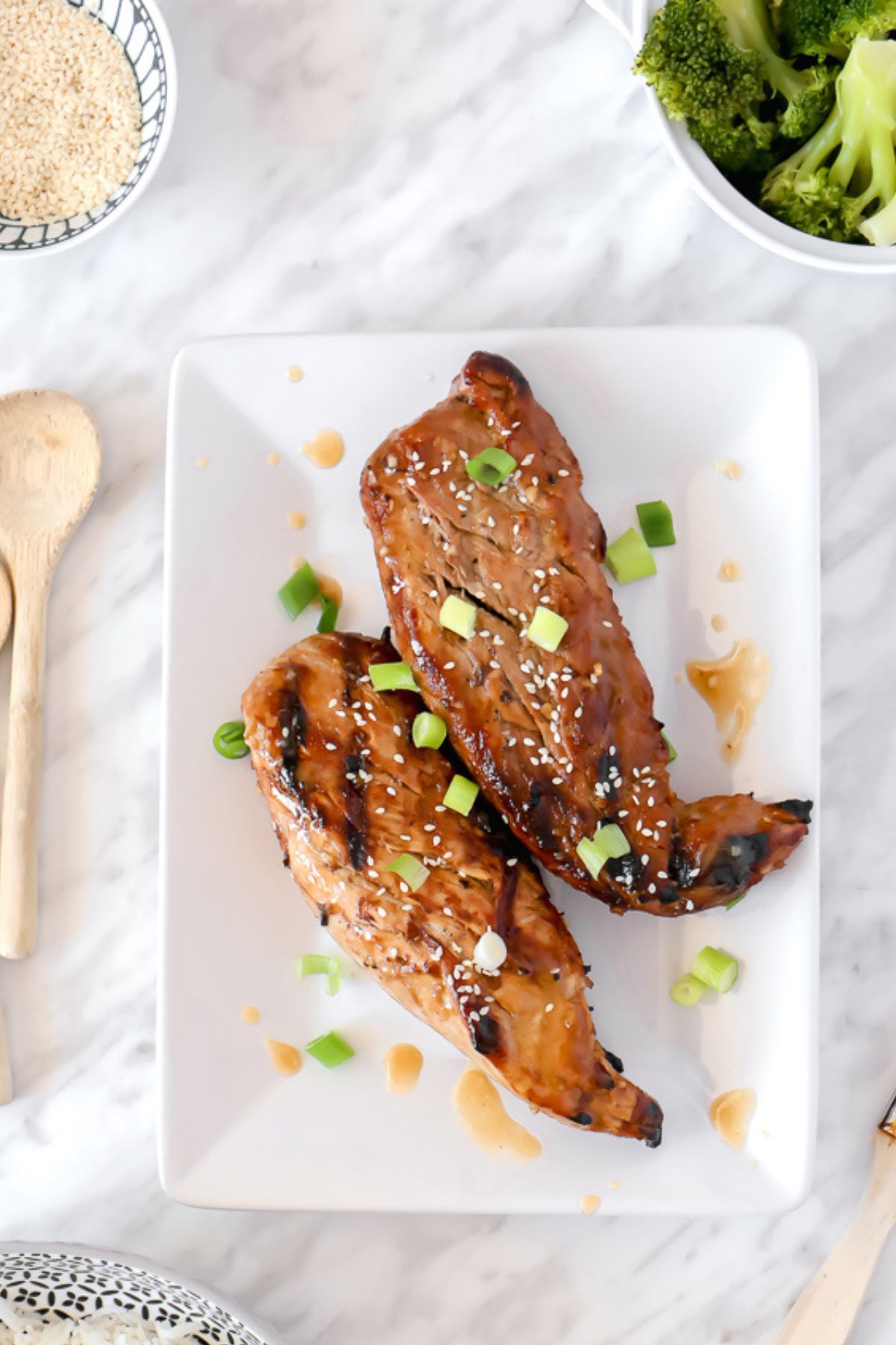 Two pork tenderloins on a plate.
