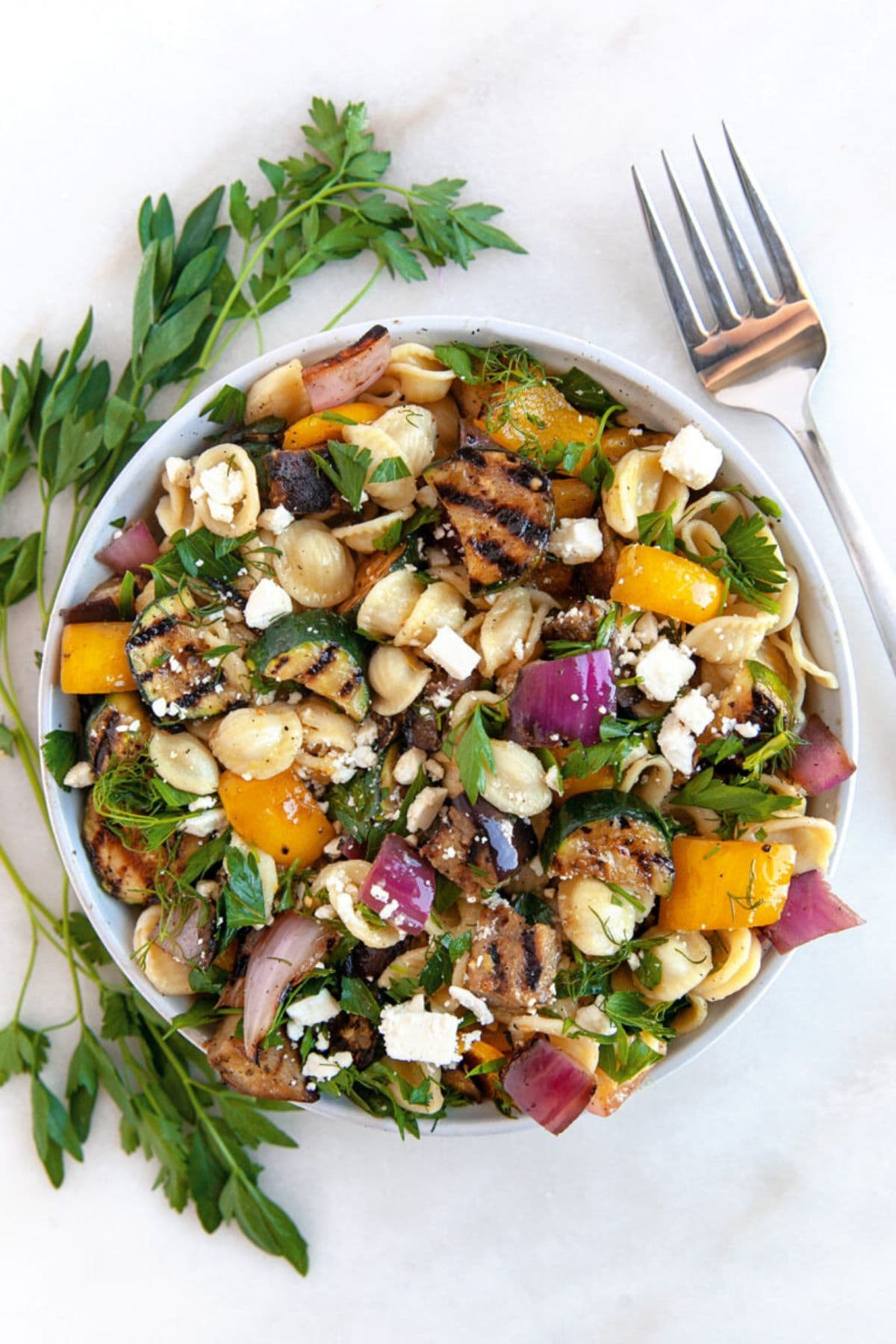 Large bowl full of veggie salad.