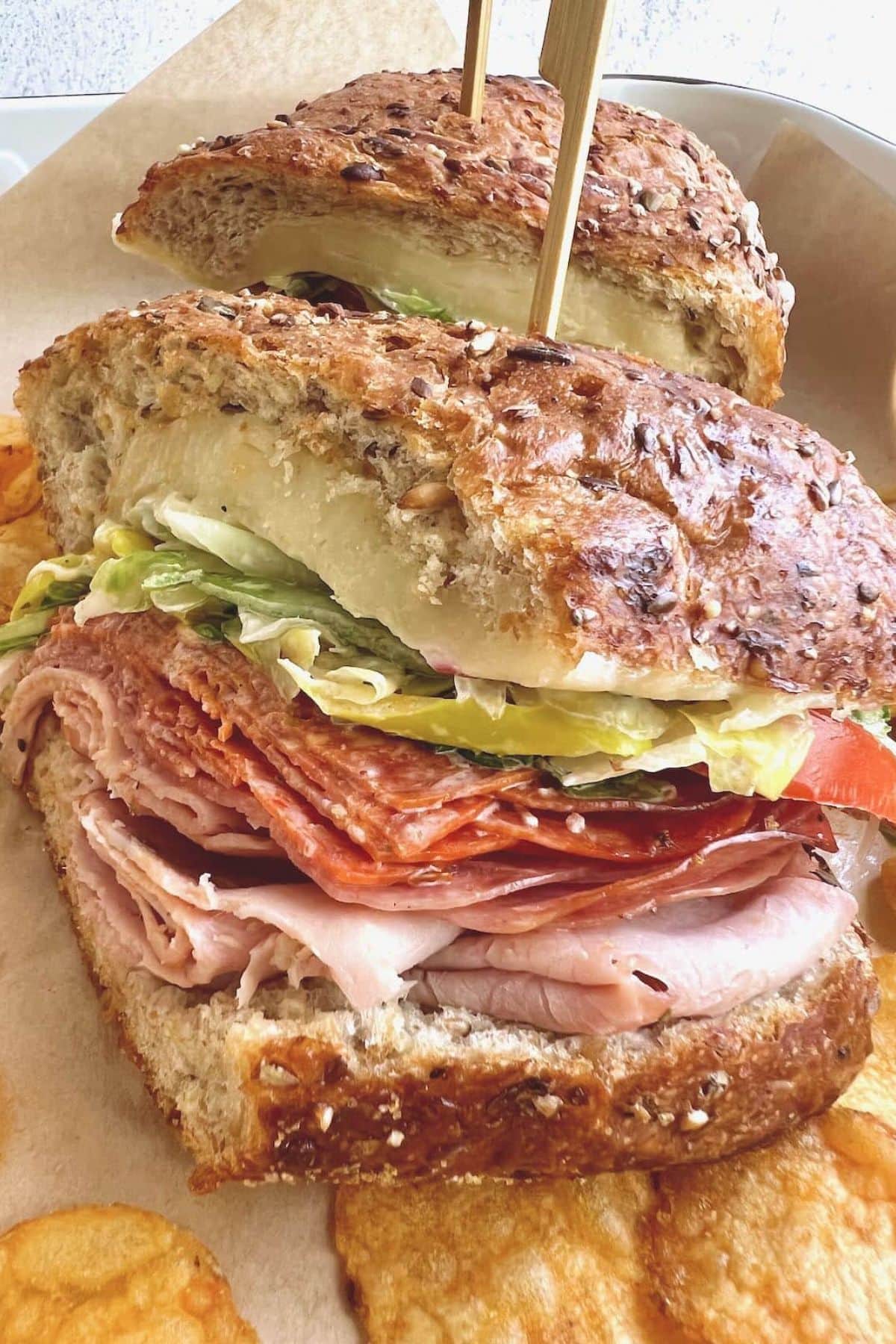 Get outside and enjoy the day with these 50 Picnic Basket Essentials. There is something for everyone to pack the perfect picnic and enjoy family time and the great outdoors. Grinder sandwich on serving tray.