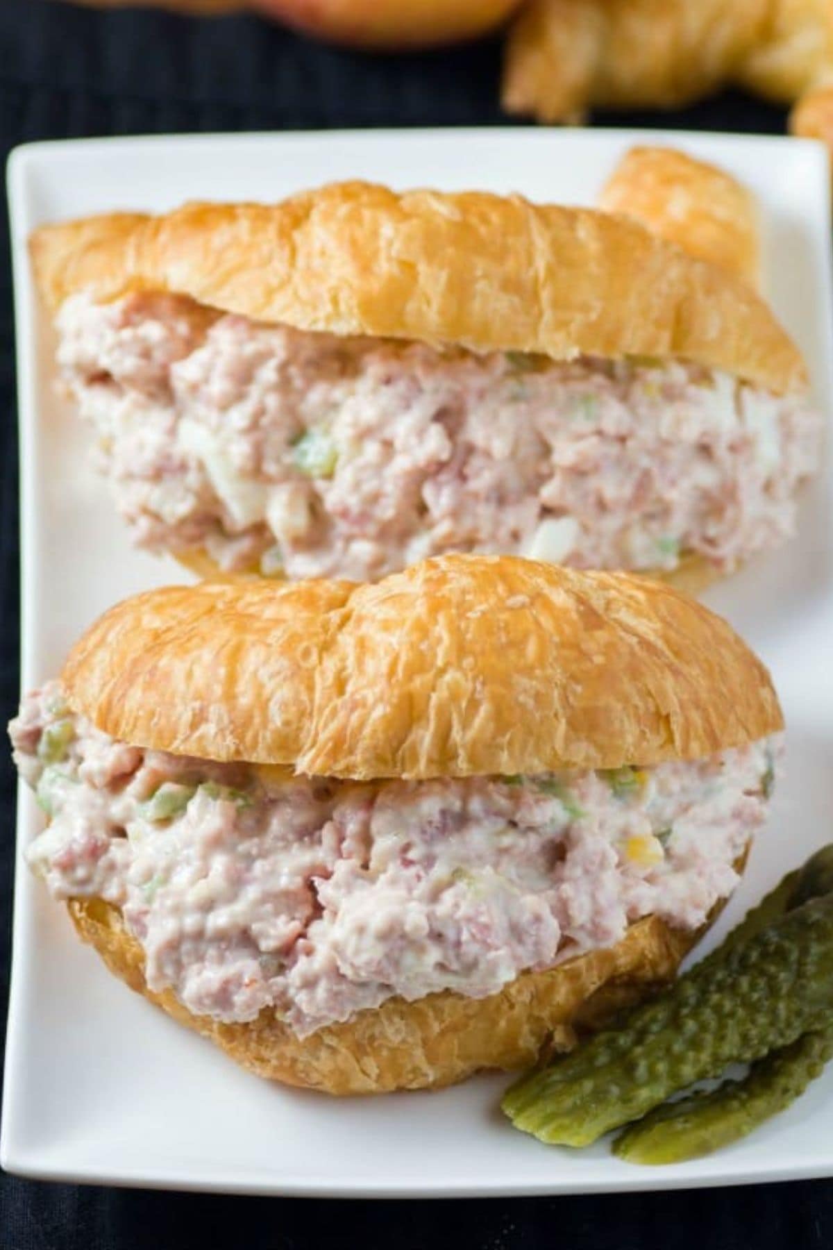 Get outside and enjoy the day with these 50 Picnic Basket Essentials. There is something for everyone to pack the perfect picnic and enjoy family time and the great outdoors. Ham salad sandwiches on a platter.