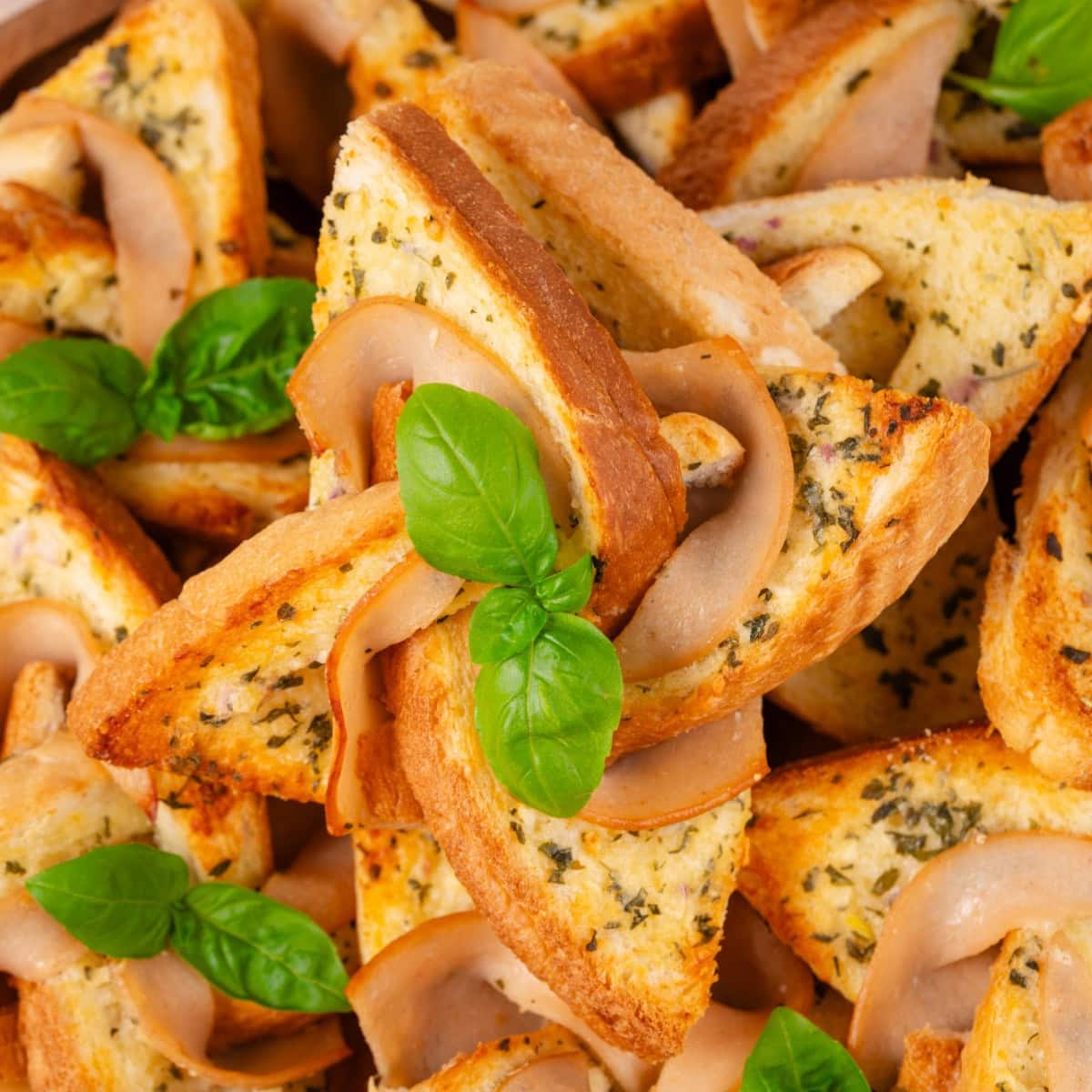 What fun are these Ham and Cheese Pinwheels, but best of all, they taste amazing. Your kids are going to ask for them all the time!! Close-up of the pinwheels.