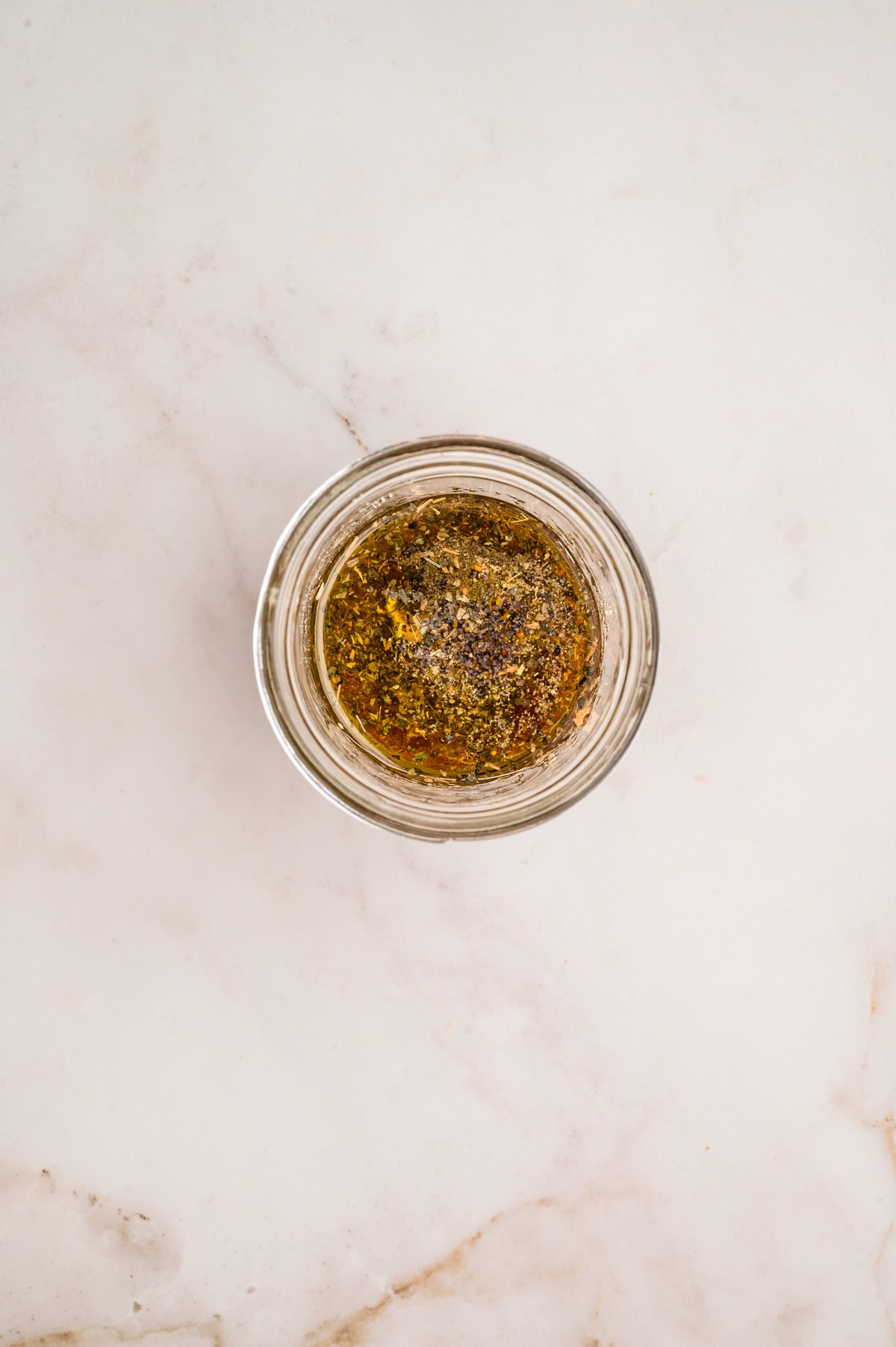 An Italian Chopped Salad adds a lot of bold flavor to any meal, but also it is healthy and delicious. This salad goes with so many mains you will want to make it again and again. Dressing ingredients in a jar.